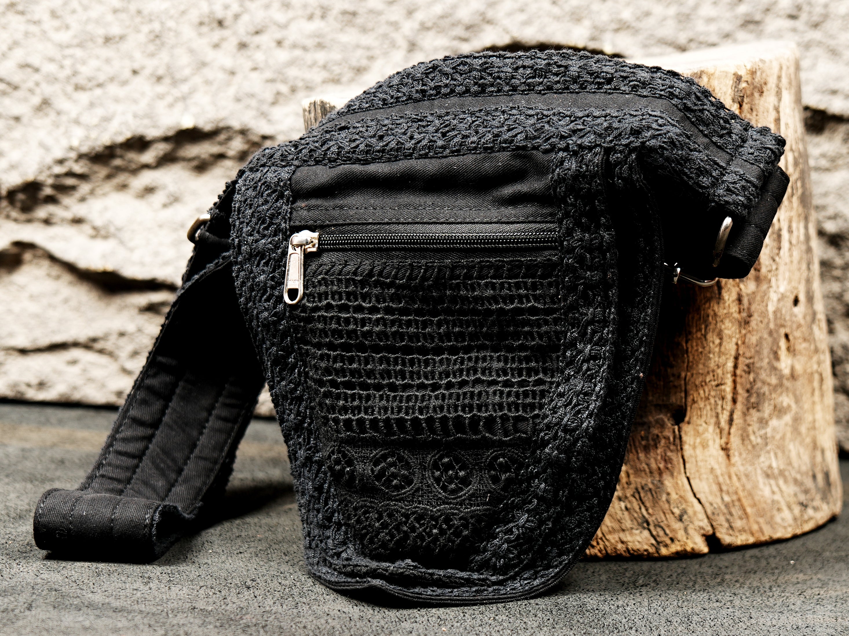 Black travel waist pack with secure zipper pocket for festivals and concerts