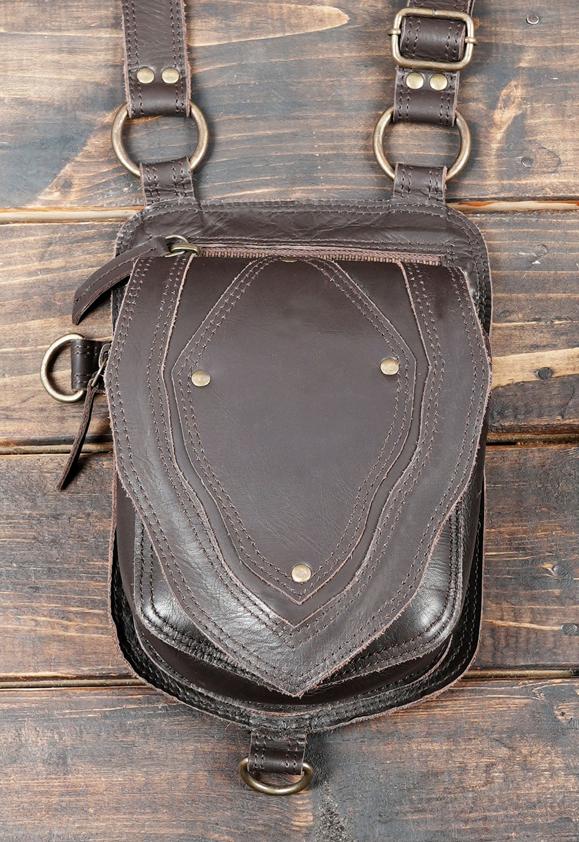 Made from genuine leather, this holster features adjustable straps that ensure a secure and comfortable fit.