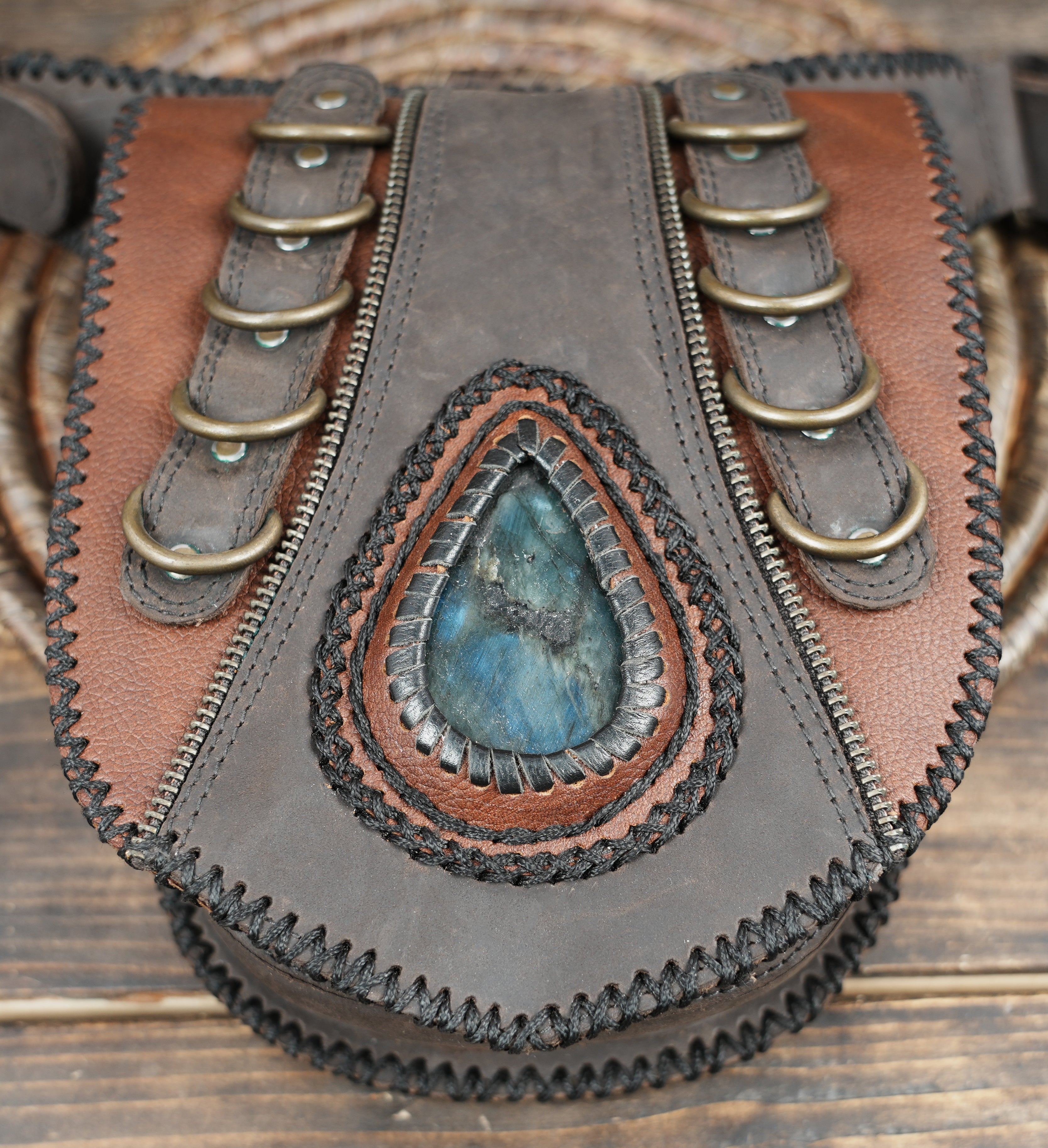 Artisan festival leather waist pouch with layered panel design