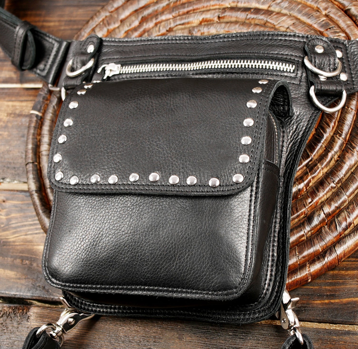 Steampunk style black leather hip and thigh bag with rivet details