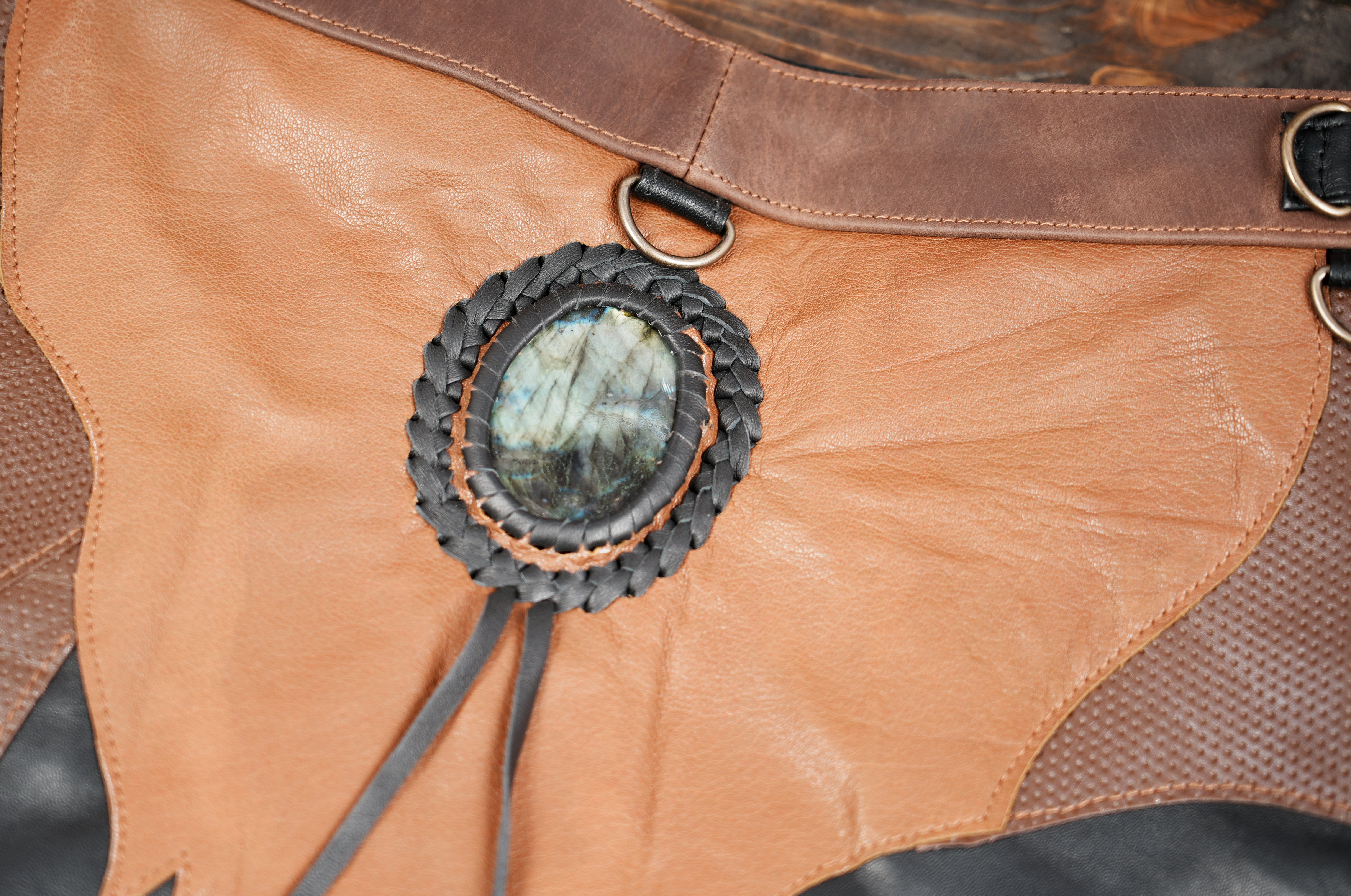 Stylish genuine leather skirt with layered pattern and metal stud detailing