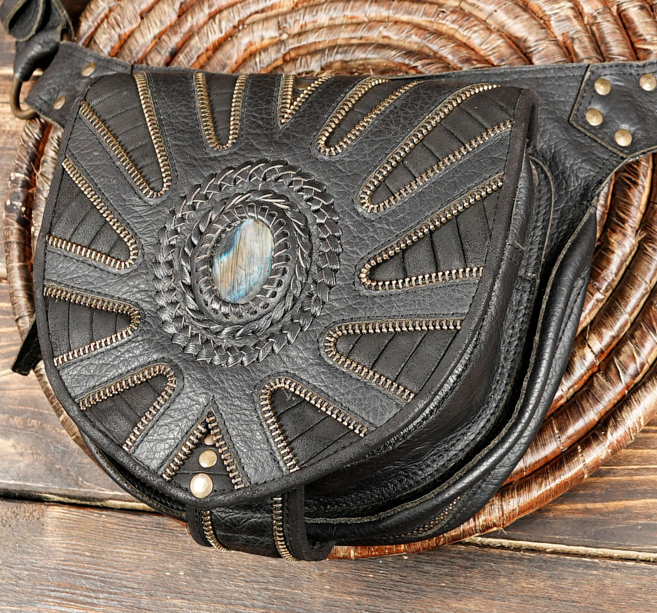 Artisan black leather hip pouch with sunburst pattern and labradorite gemstone