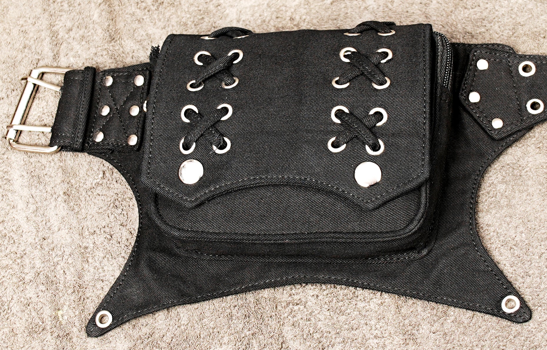 Edgy black studded utility hip belt with steampunk and cyberpunk vibes.