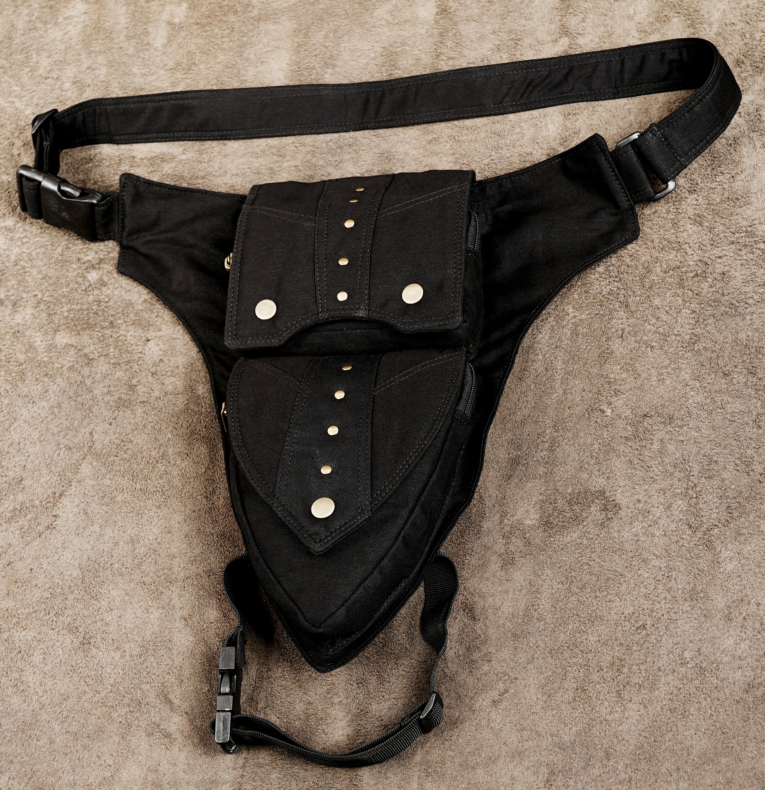 Front view of black cotton waist belt with two-layer flap pouch