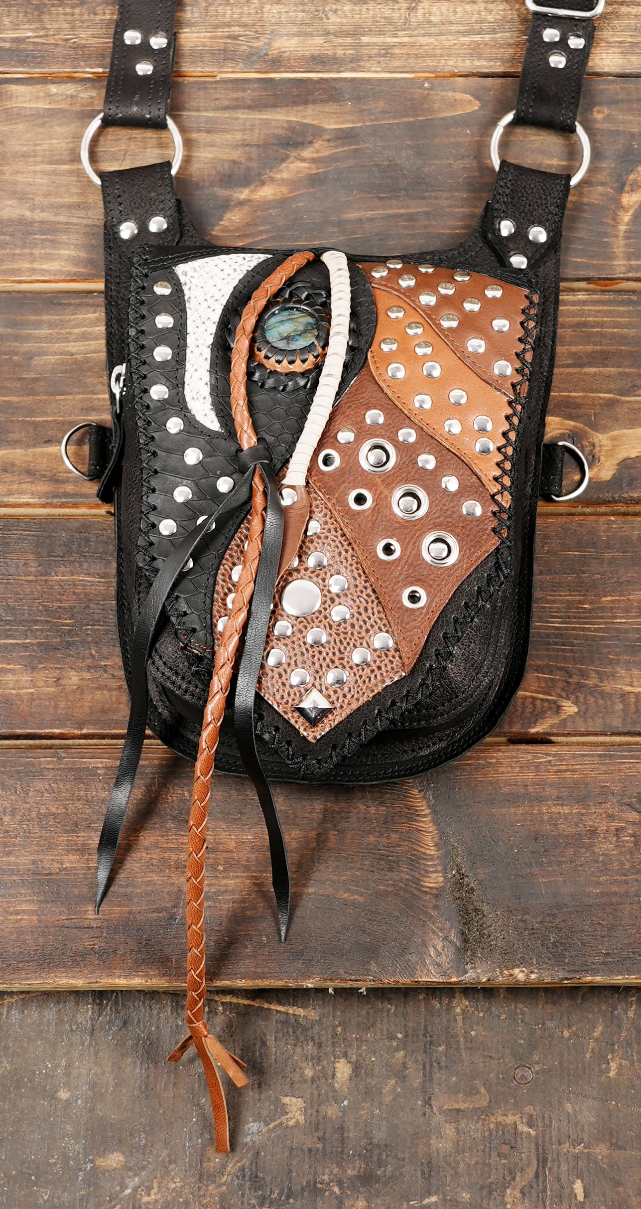 Dual pocket cowboy-style leather holster harness with silver studs