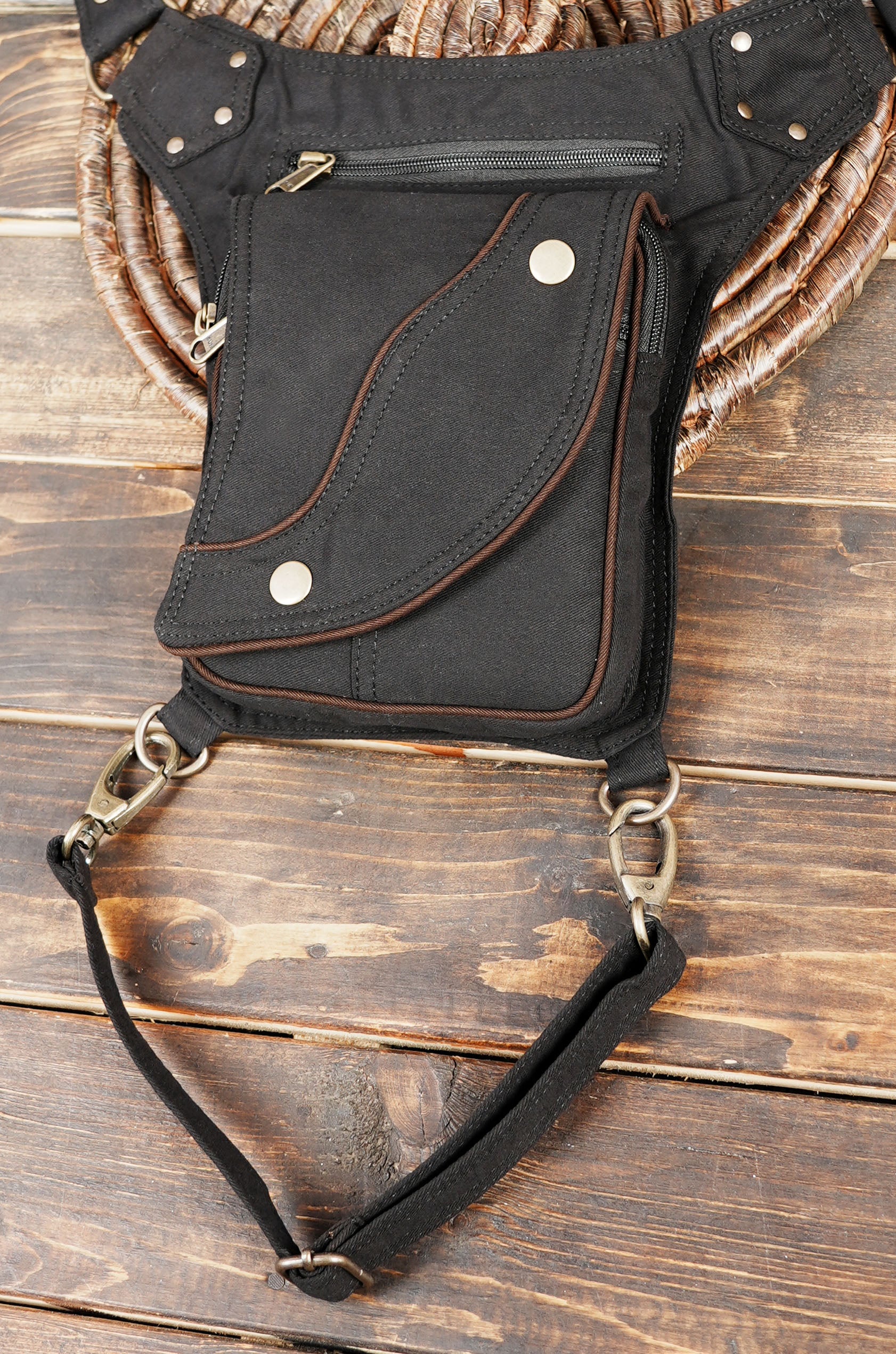 Unisex black thigh bag with zipper and snap closures