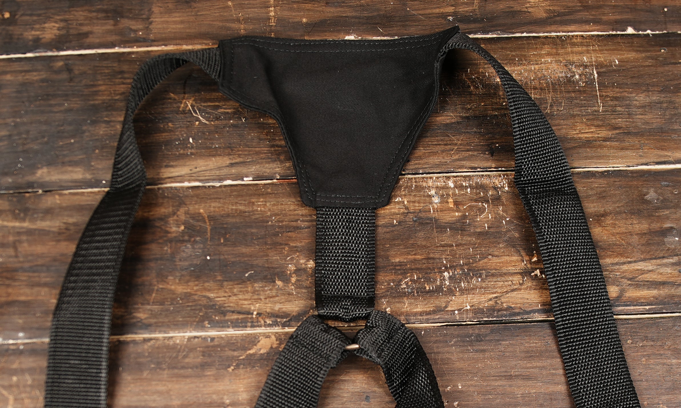 Adjustable black cotton body bag with secure storage compartments