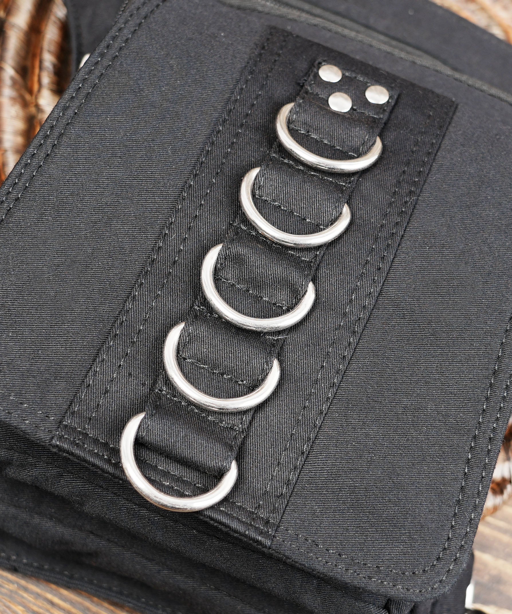 Black cotton belt bag with adjustable waist and thigh straps for men and women