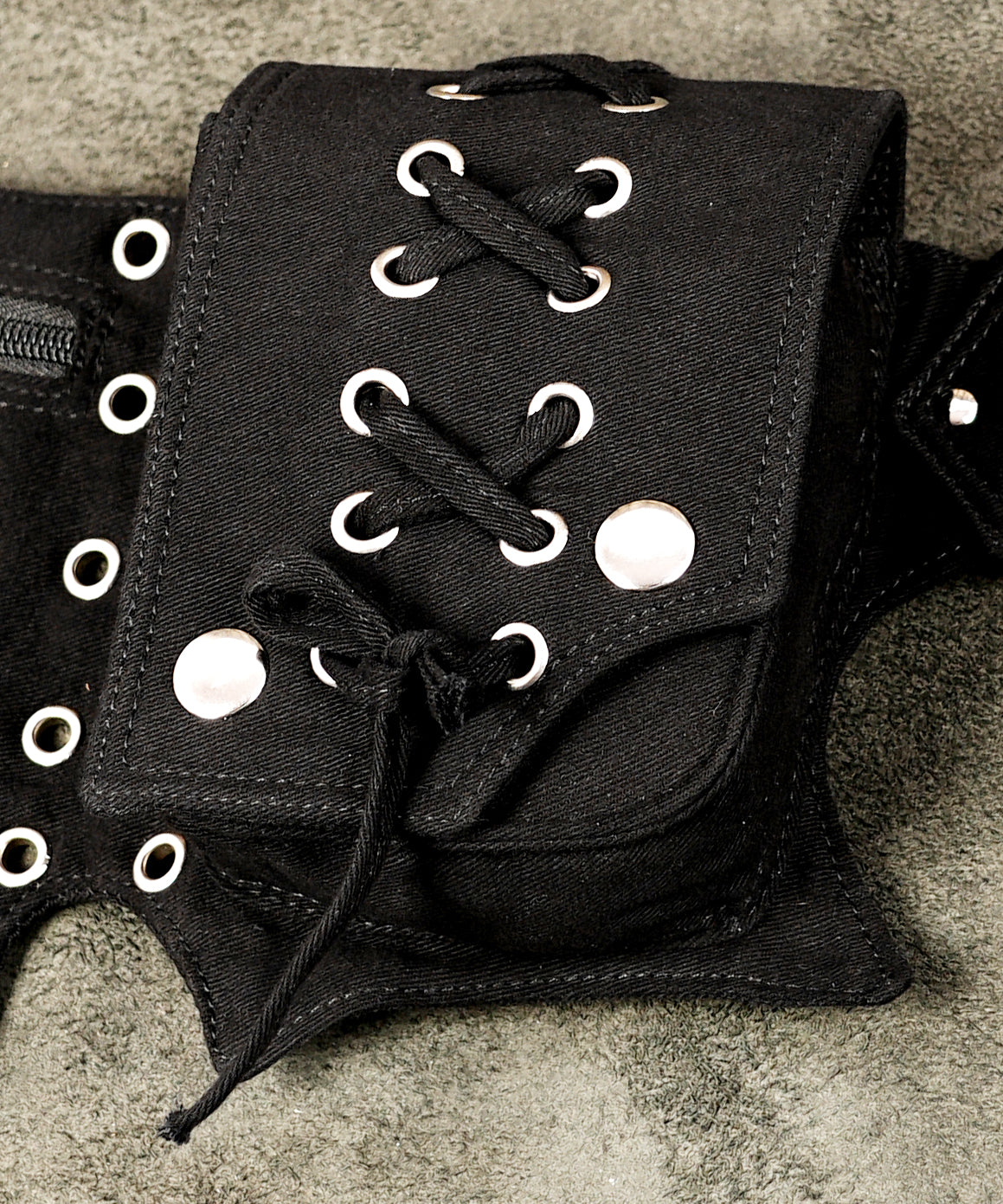 Handmade black canvas hip belt with lace-up pockets and metal studs