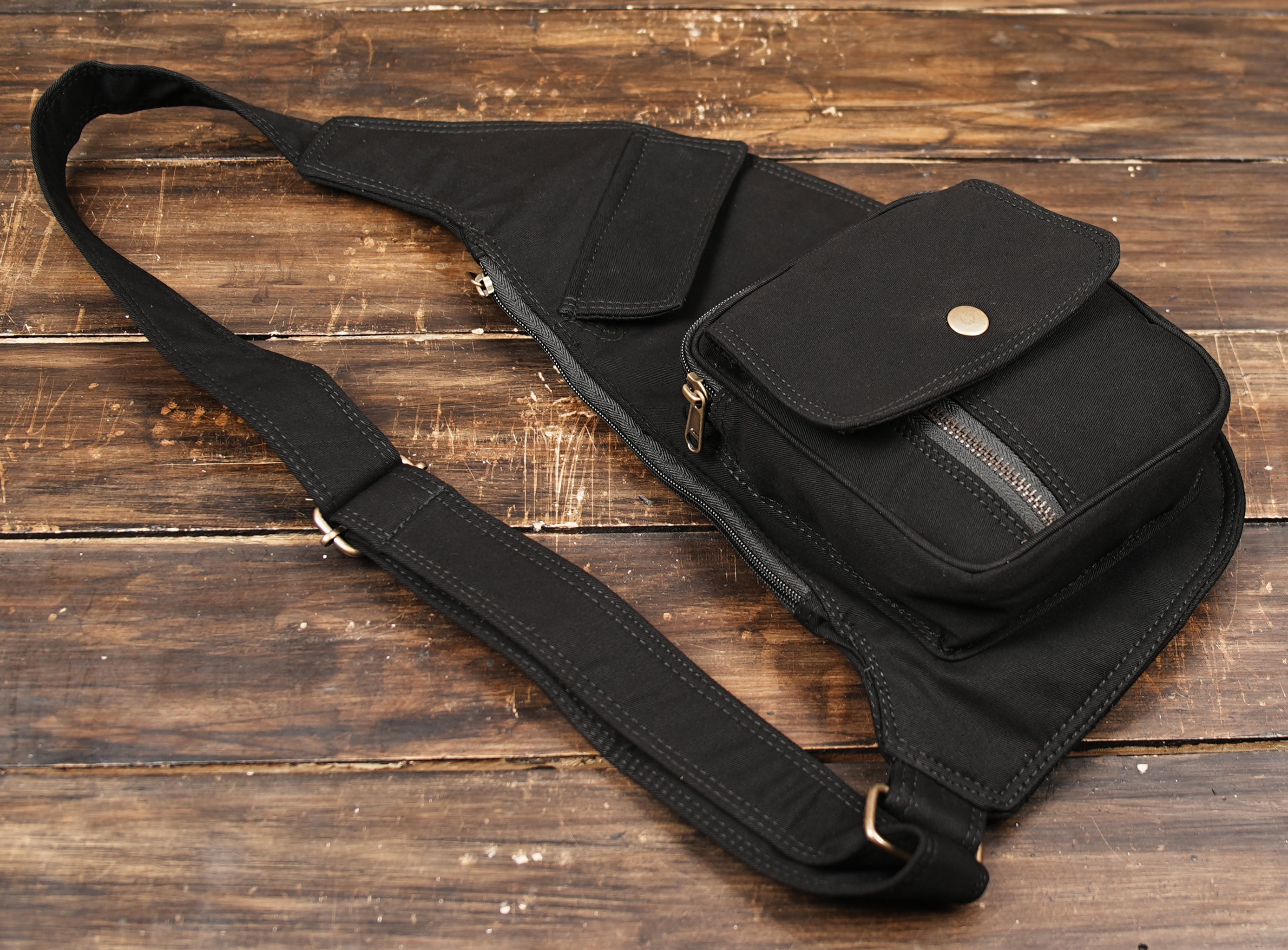 Steampunk style canvas shoulder pack with adjustable straps and secure compartments