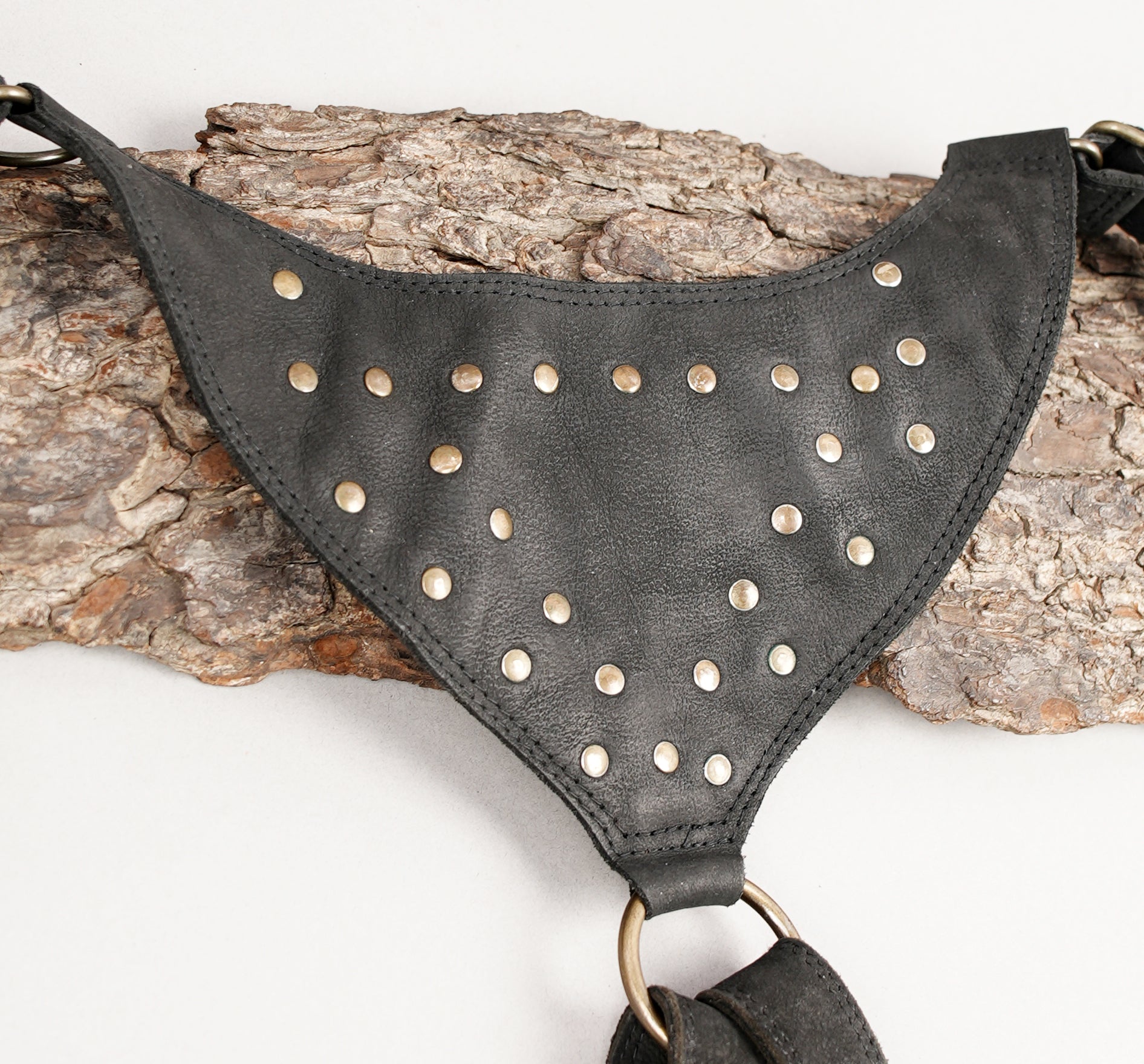 Adjustable leather shoulder harness with studded detailing
