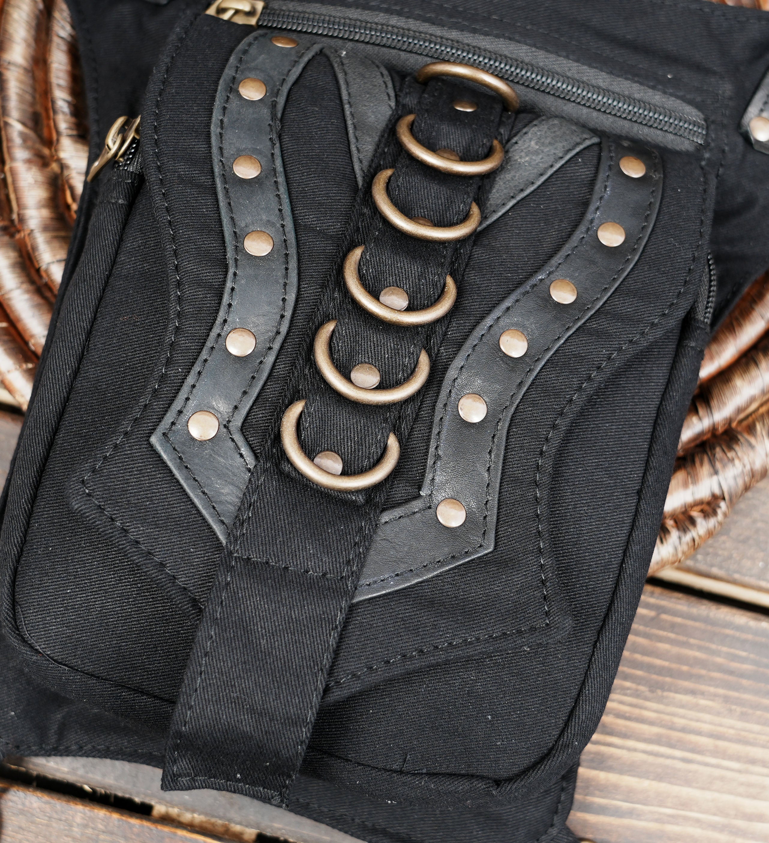 Festival thigh pocket belt with adjustable leg strap and decorative metal rings.