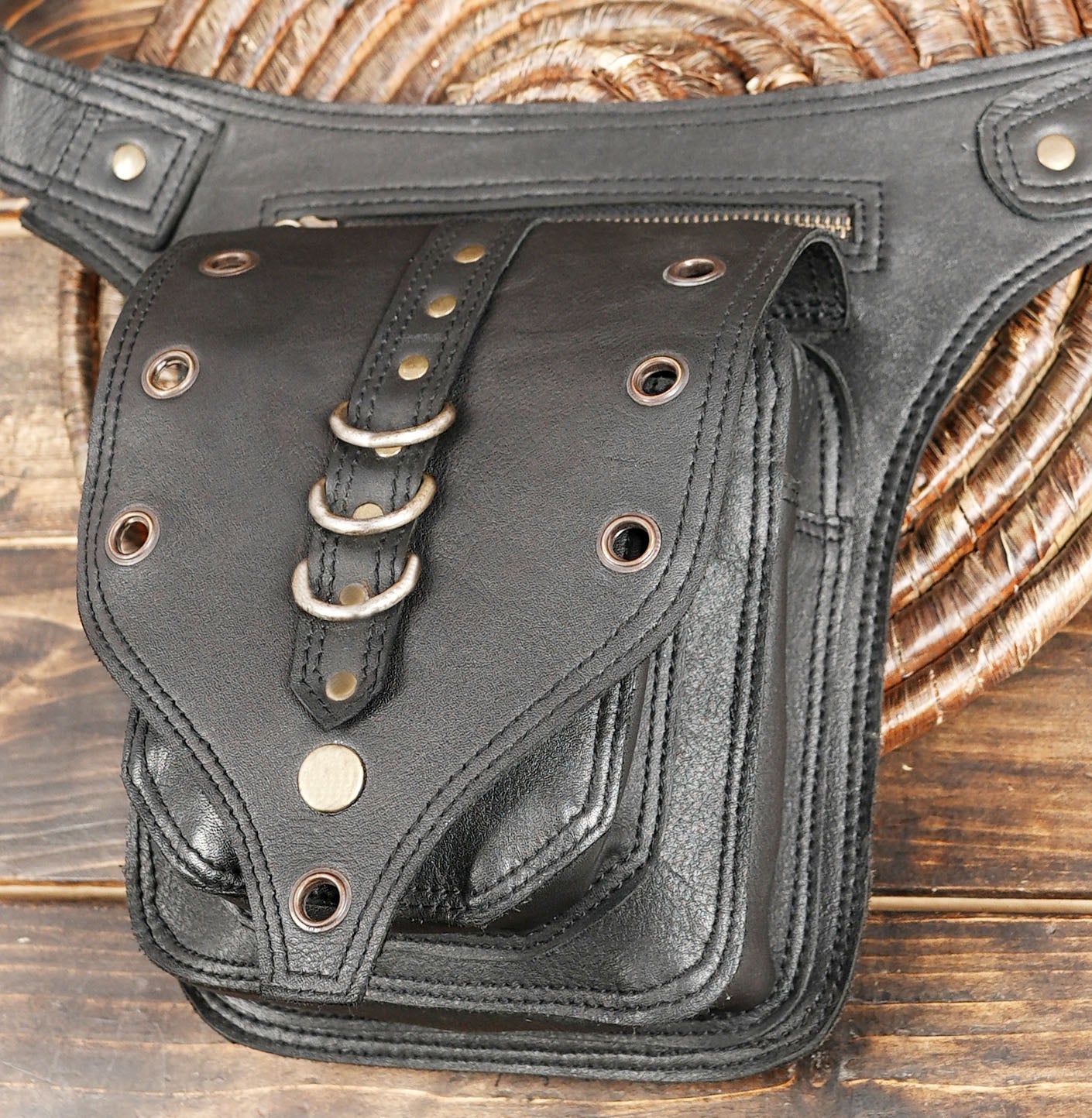Festival ready black leather hip bag with rivets and rings