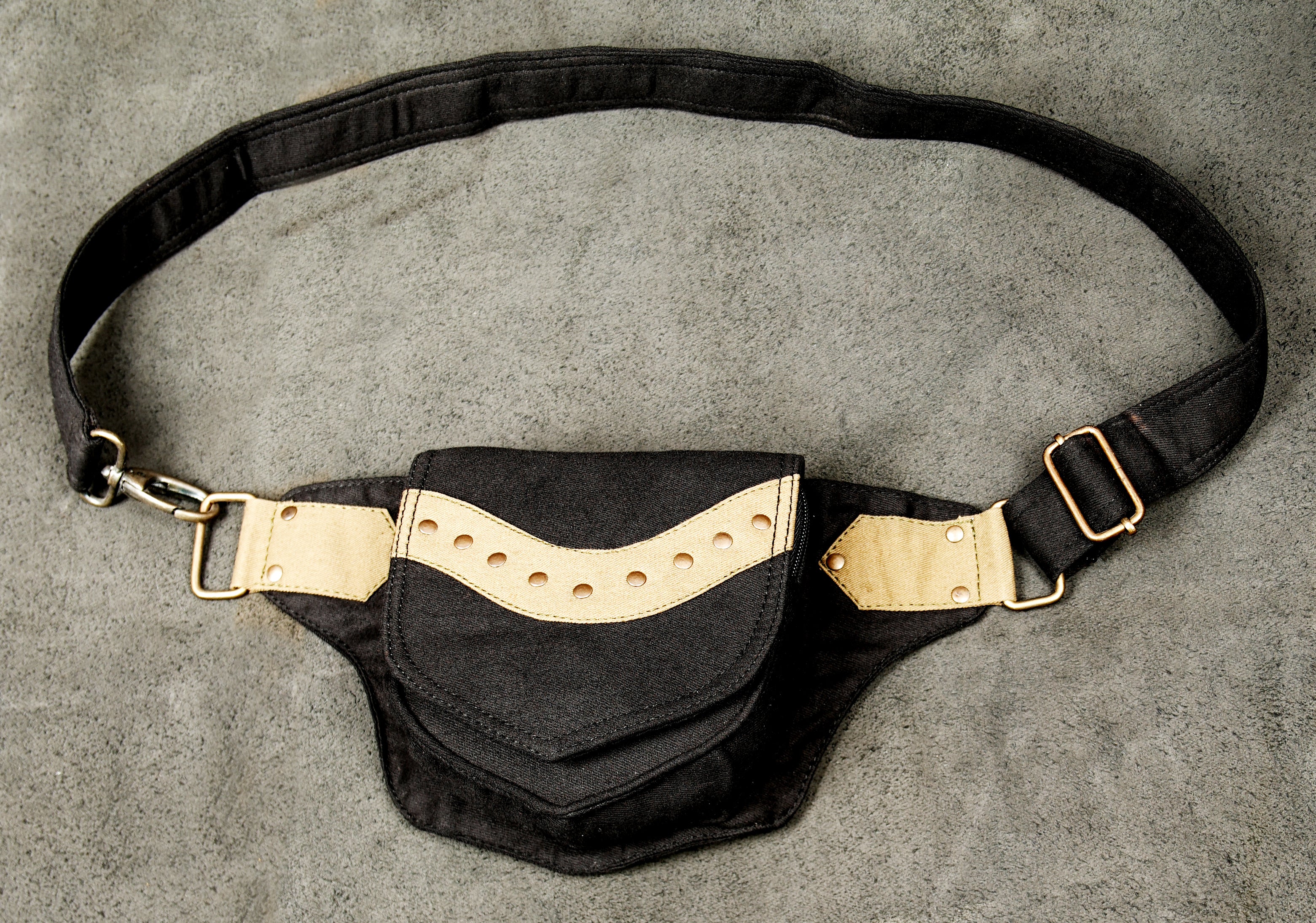 A natural fiber belt pouch in black, offering a durable alternative to synthetic waist packs.