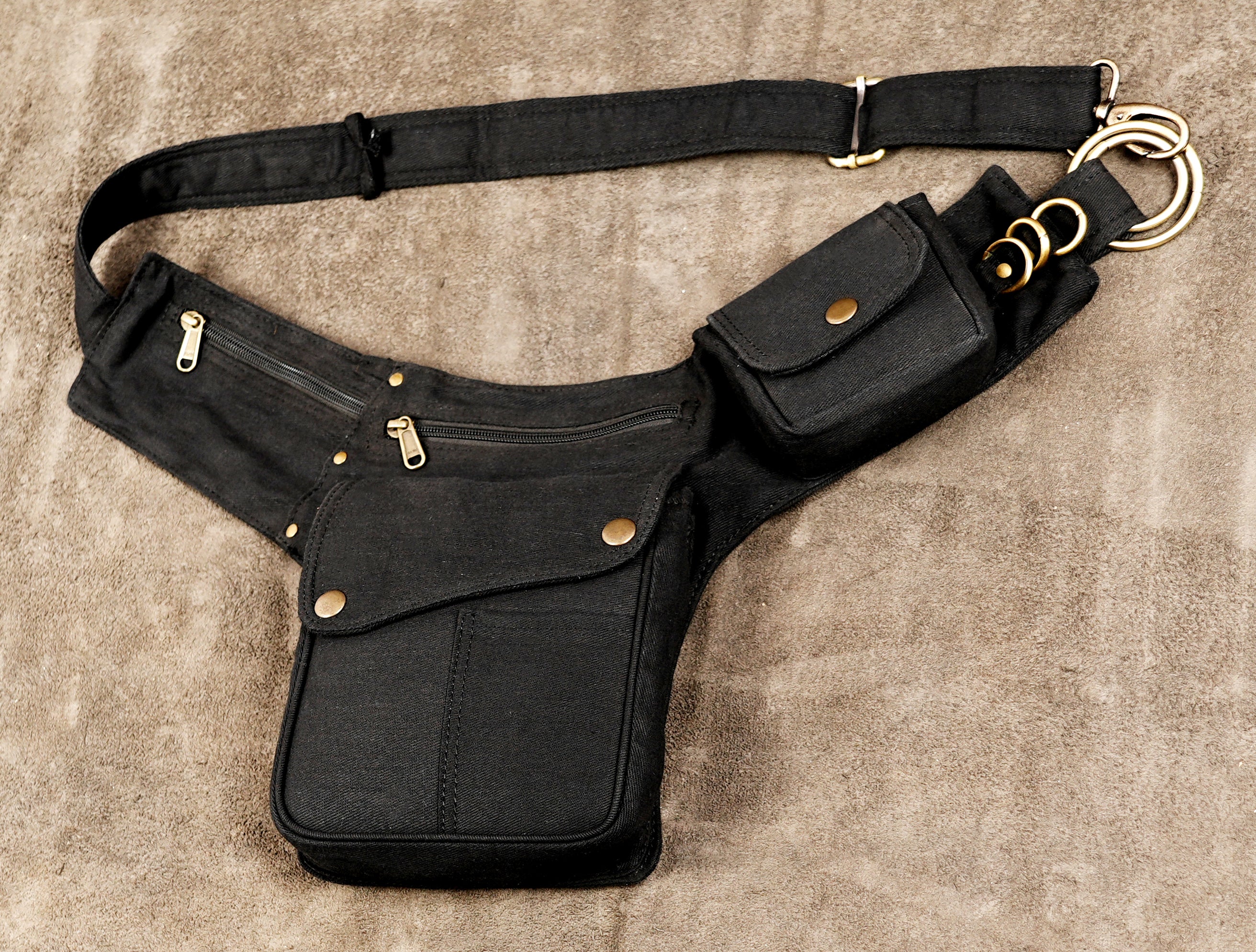 Hands-free black hip pack with antique brass hardware and rings