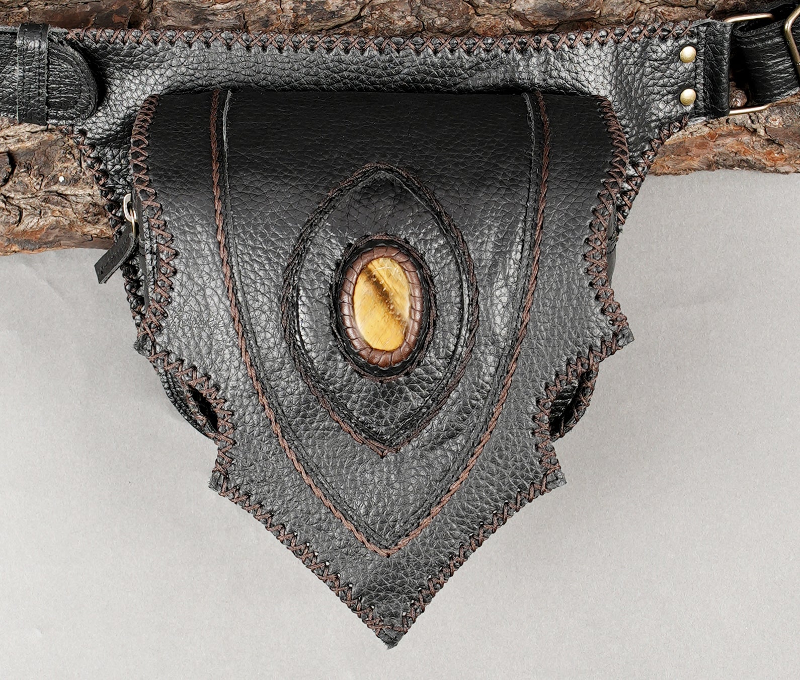 Artisan leather hip belt with pointed flap and stone detail