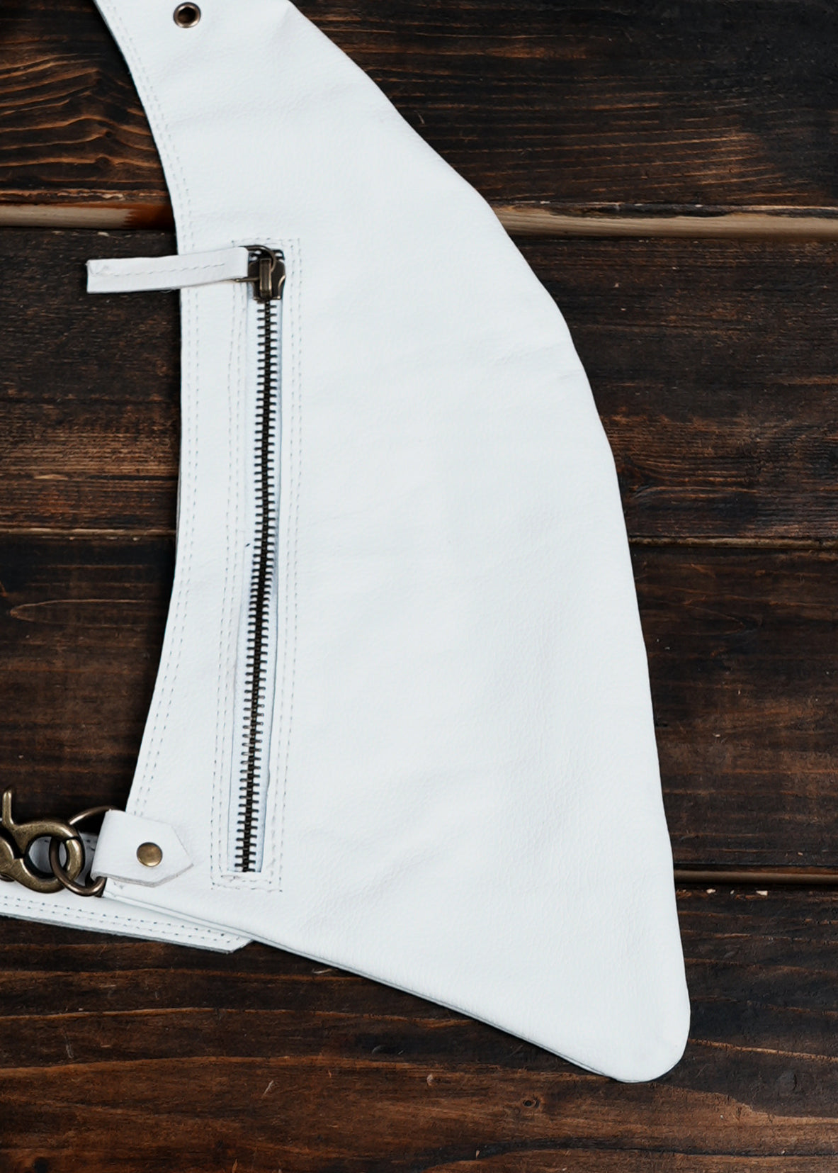 Minimalist white leather body holster for festival wear