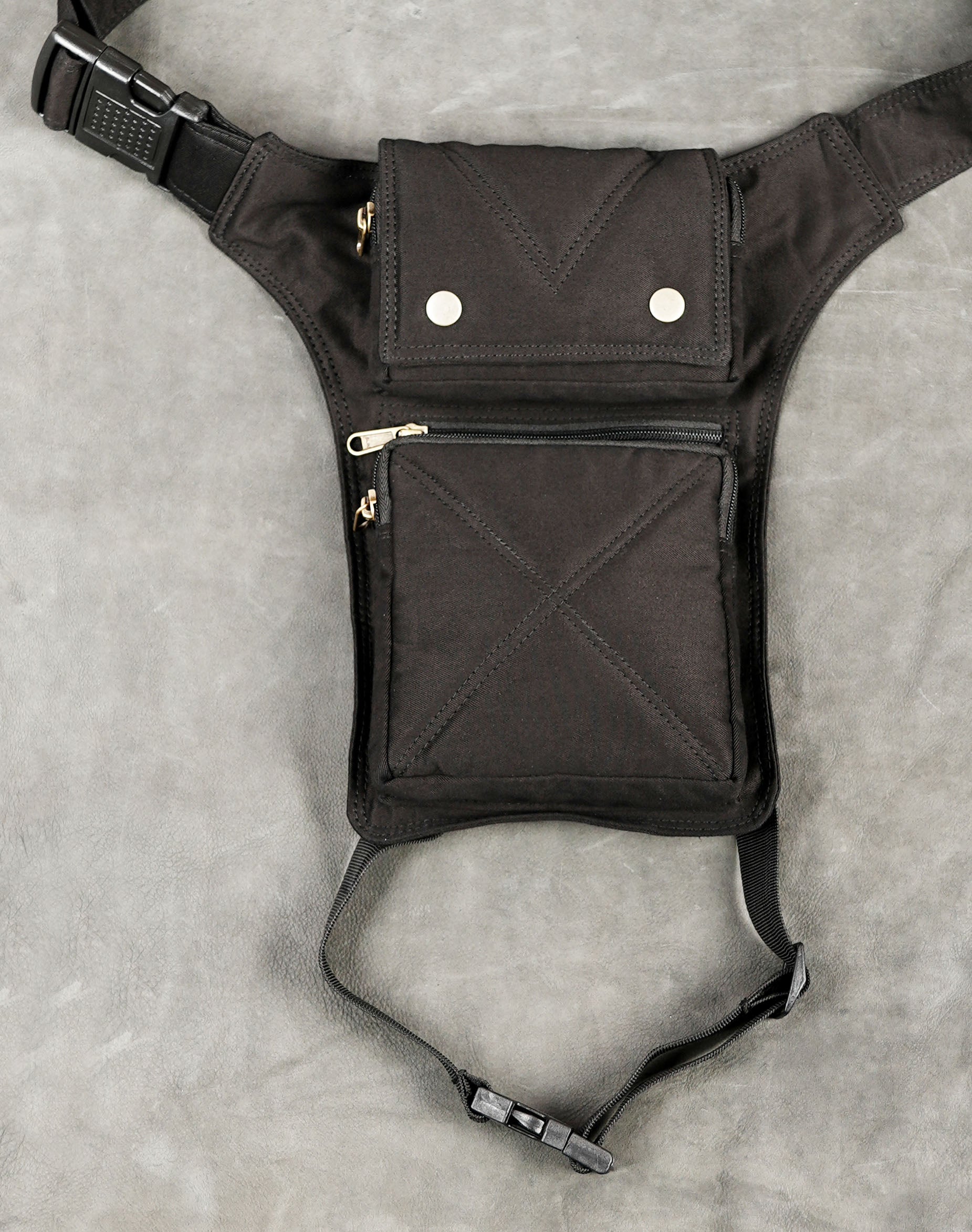 Black cotton drop leg utility bag with nylon webbing thigh strap