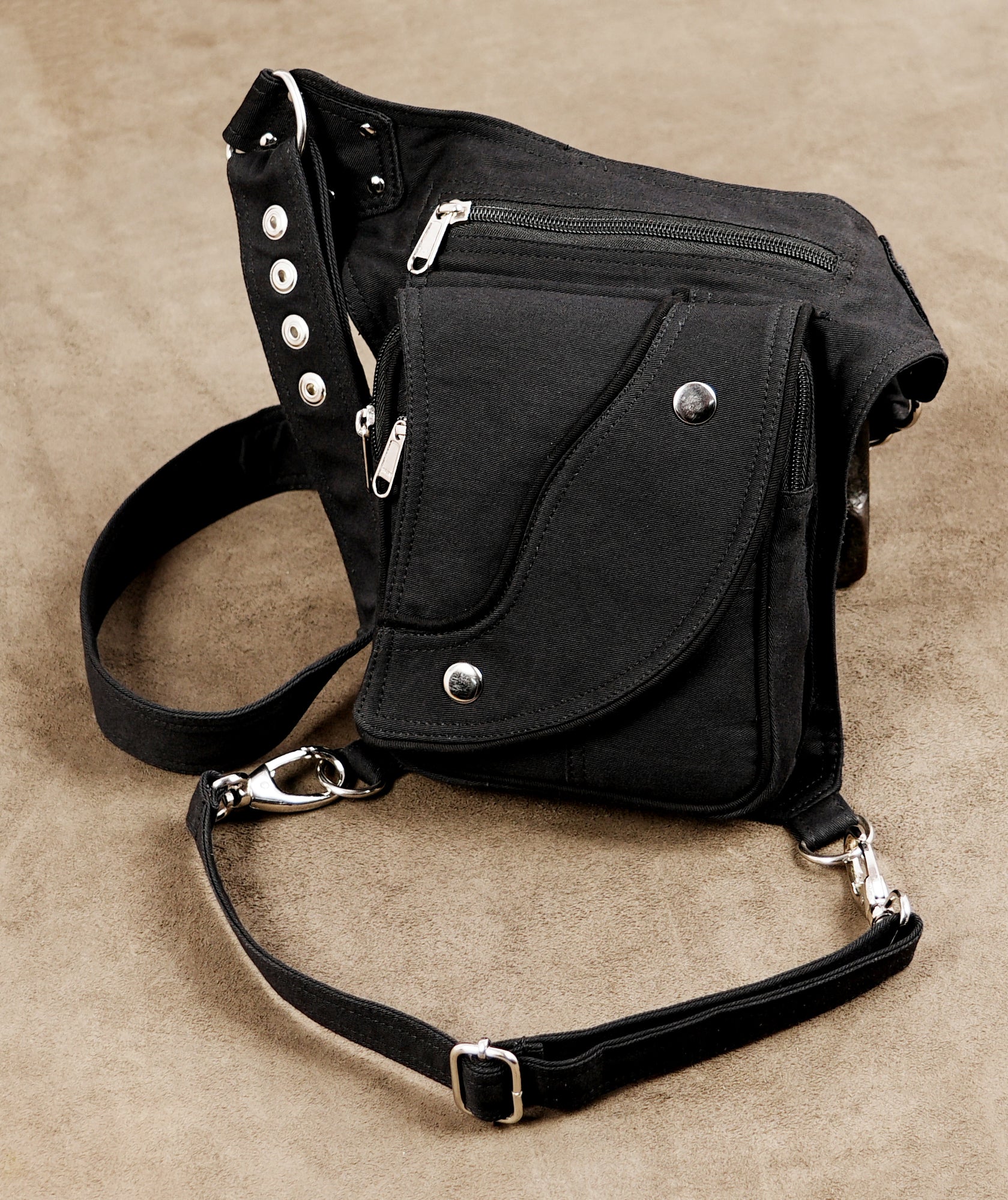 Black utility leg bag with waist belt and silver clip hooks