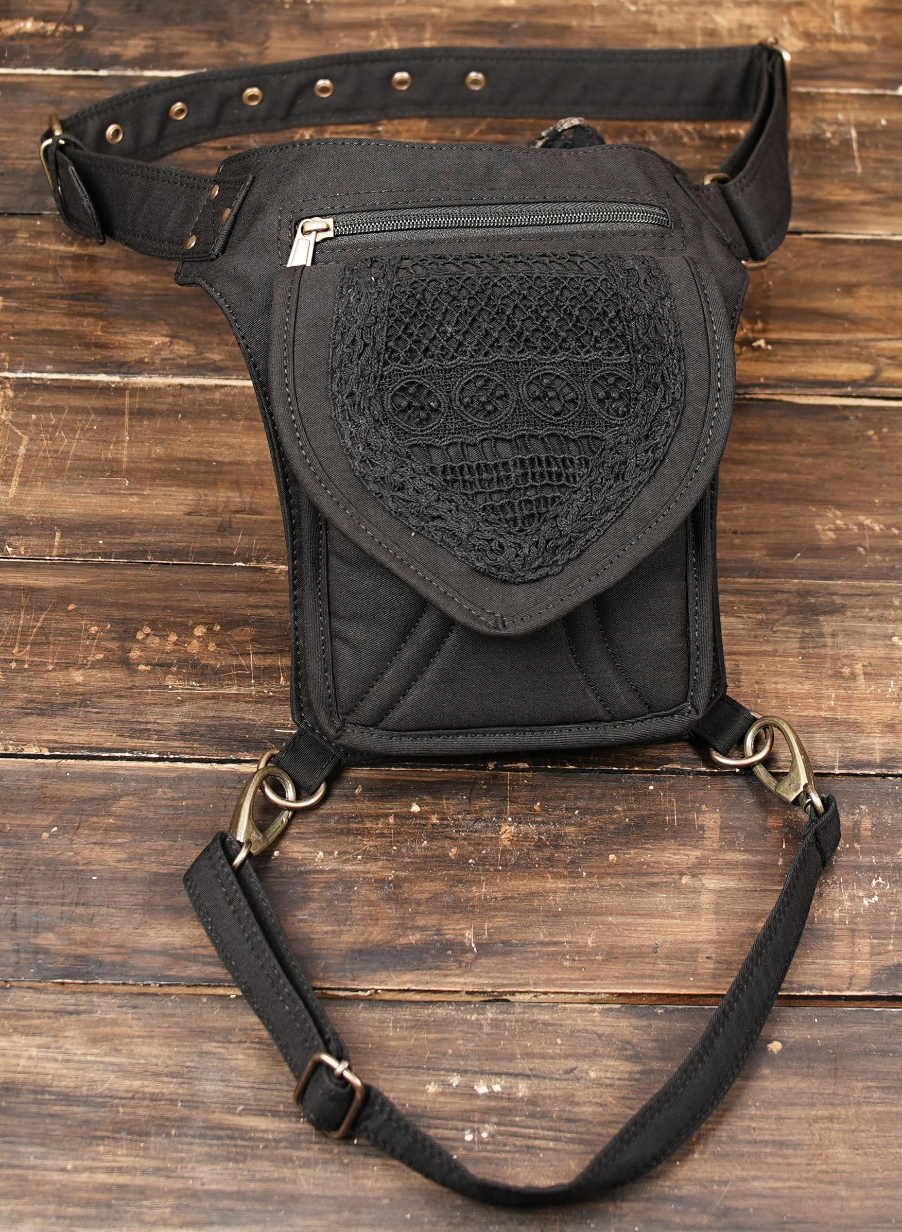 Tribal style canvas side thigh pack with front flap pocket and brass grommets.