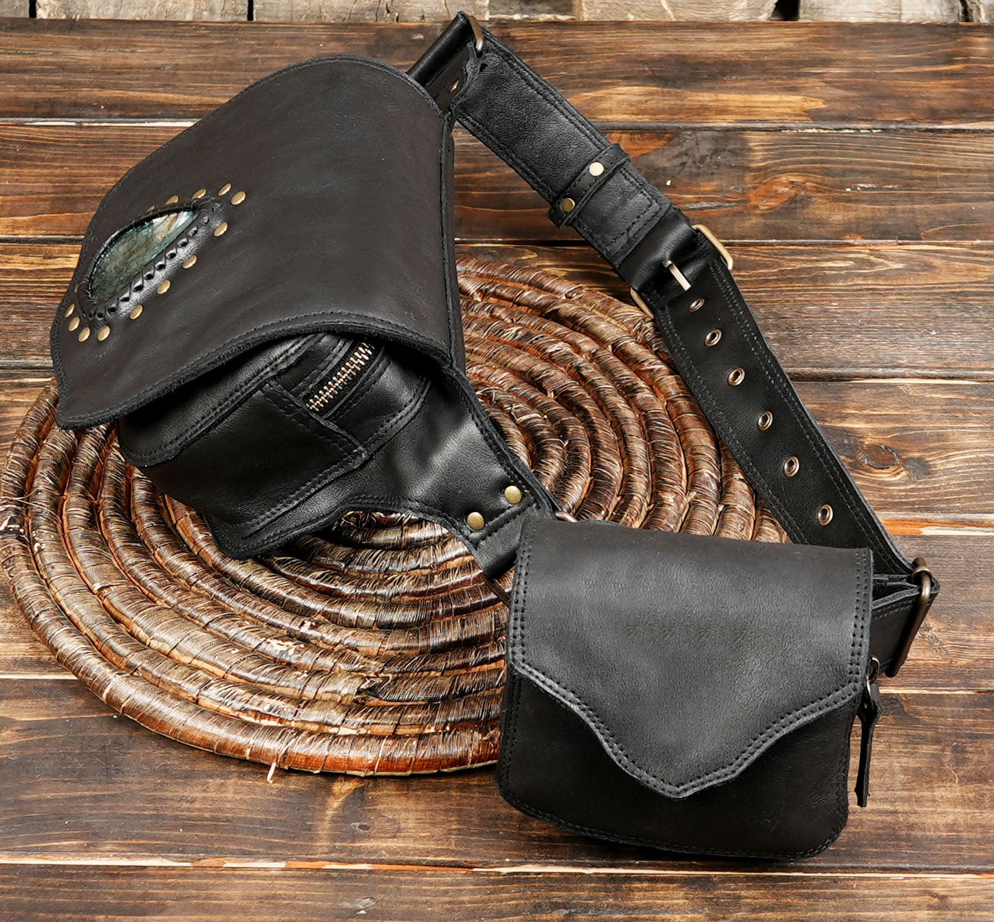 Close-up of gemstone detail on black leather fanny pack