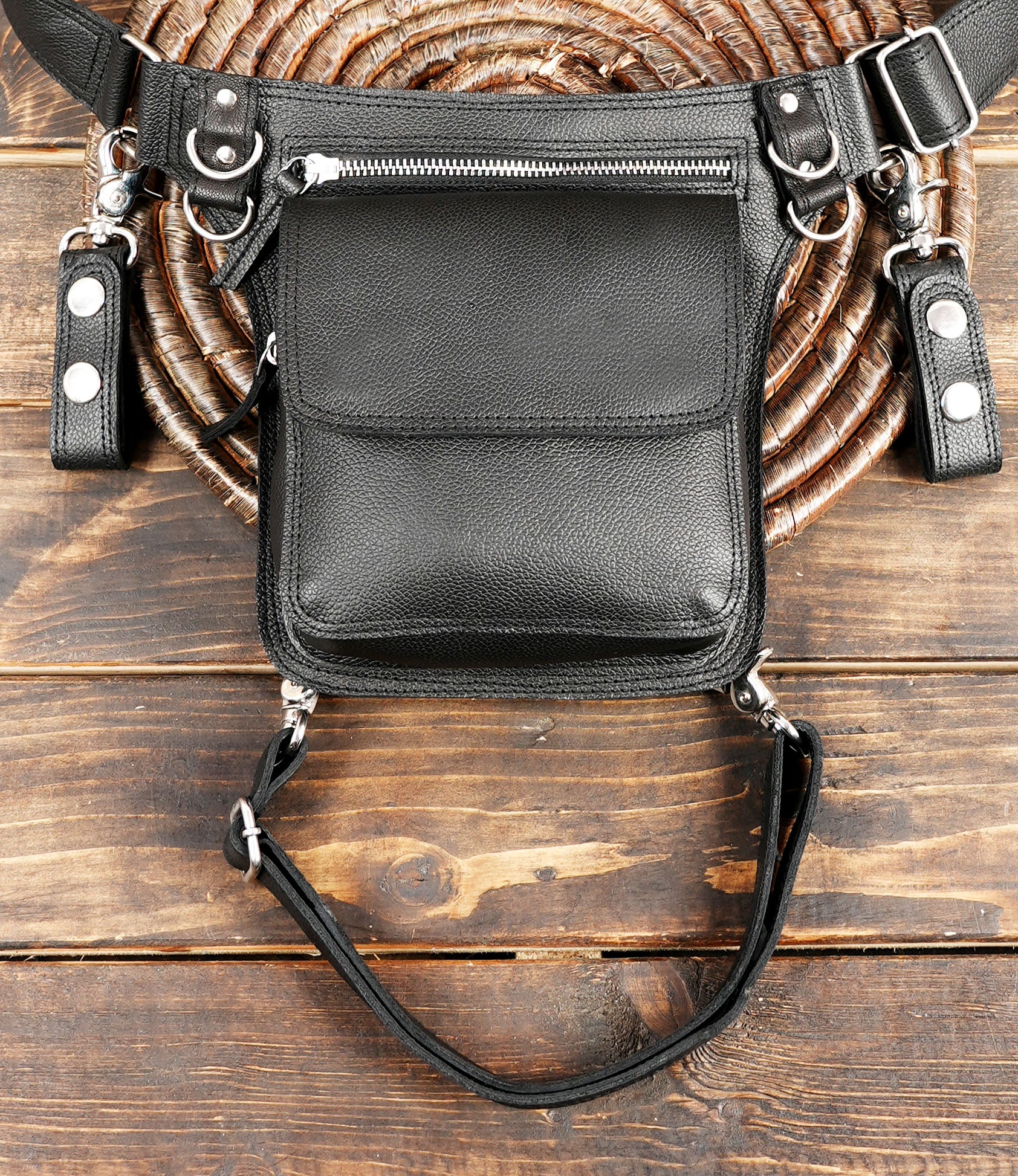 Handmade black waist bag crafted from genuine leather for rugged durability.