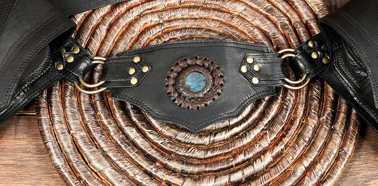 Artisan-crafted leather hip pouch with gemstone accent