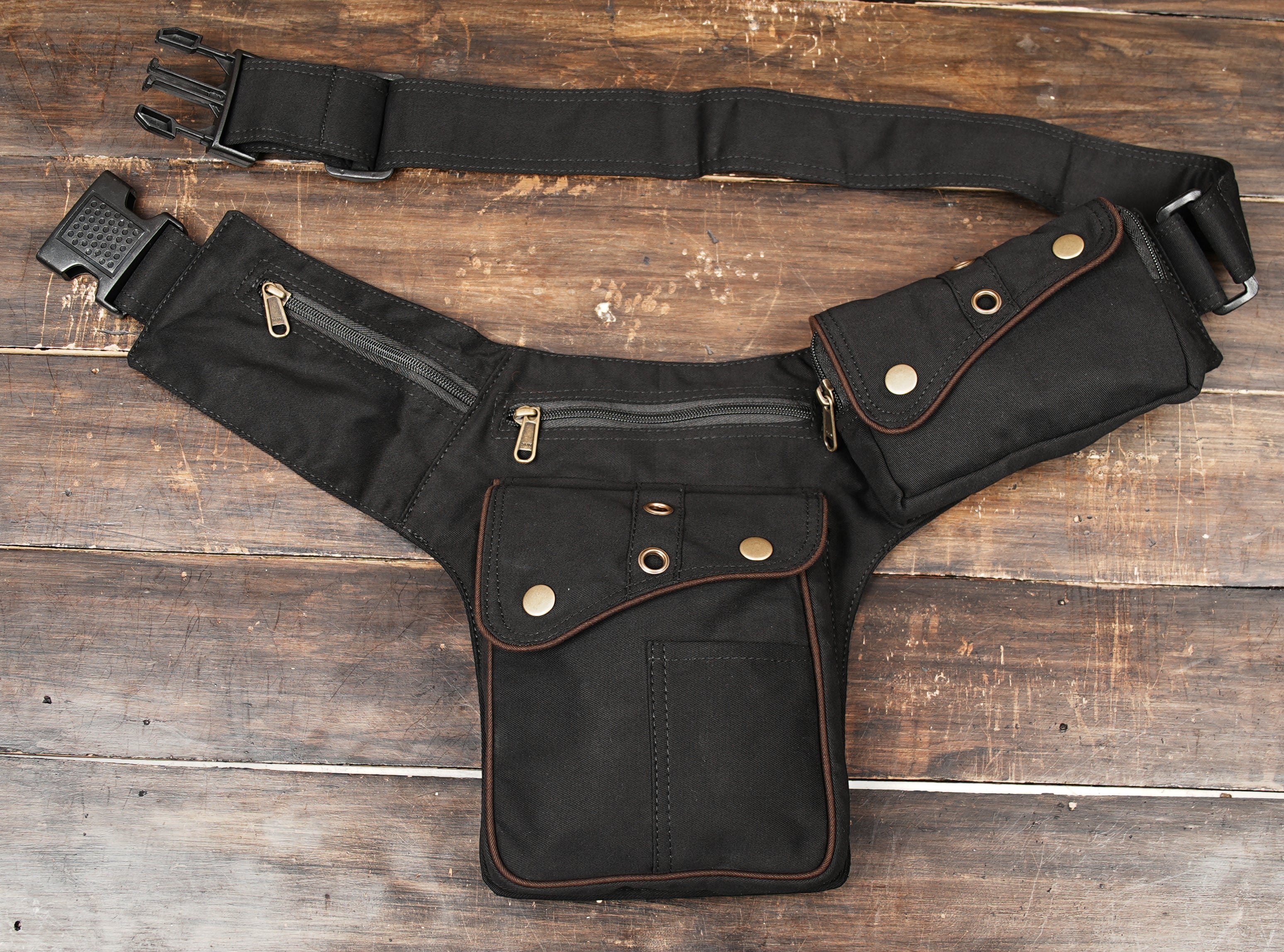 Black utility fanny pack with large pocket and zipper compartments