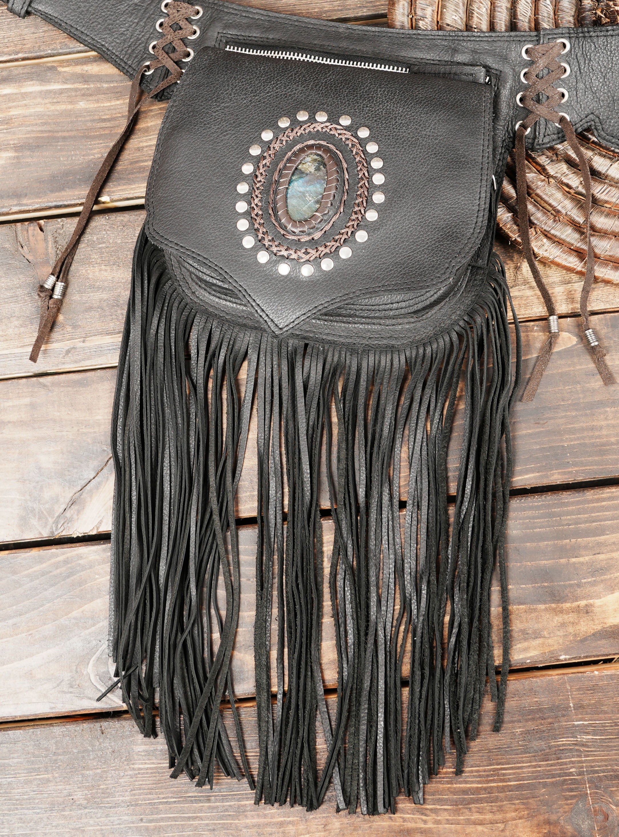 Leather waist belt bag with gemstone accents and fringe detailing