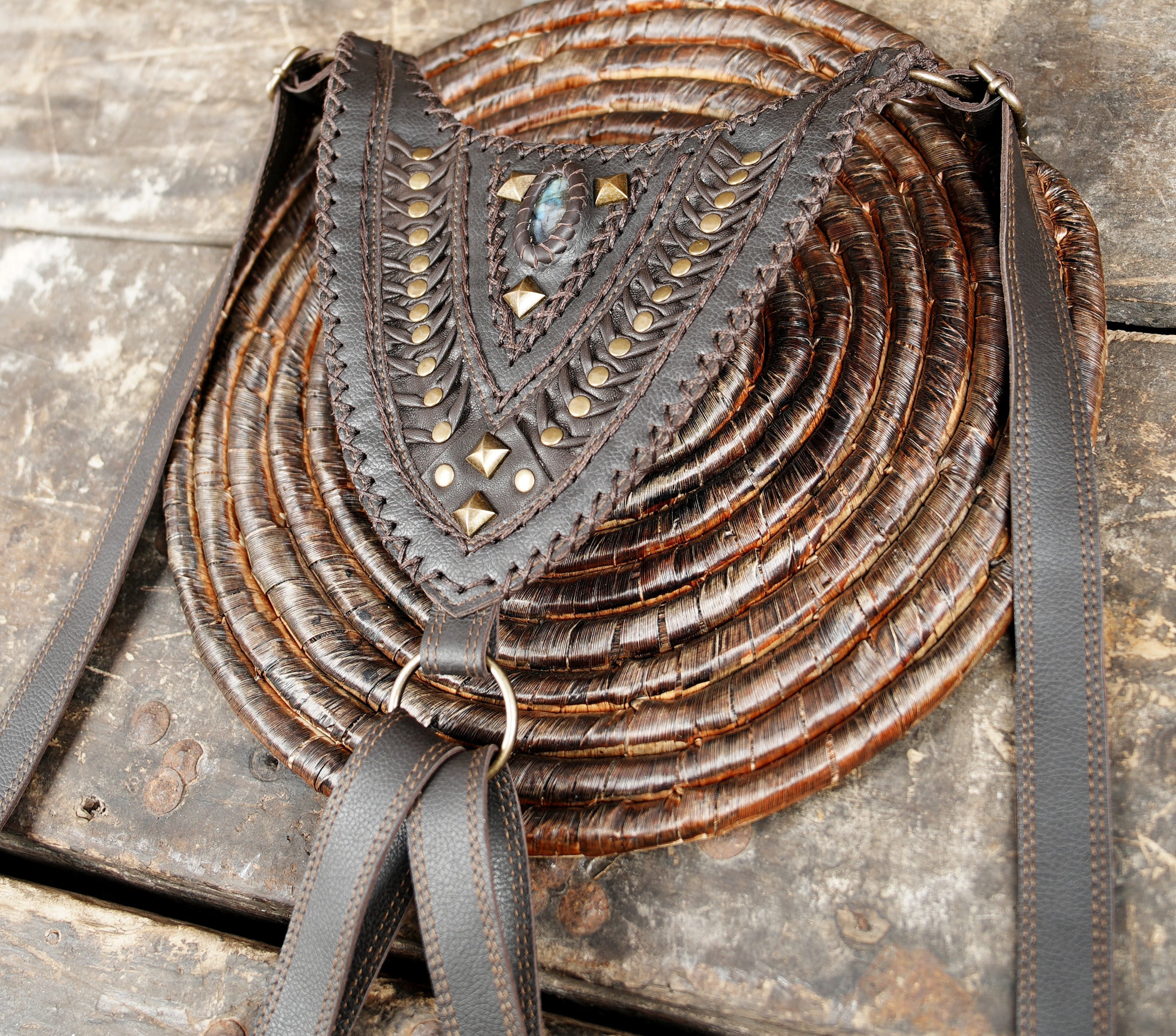 “Premium dark brown leather utility holster with gemstone inlay and textured flaps”