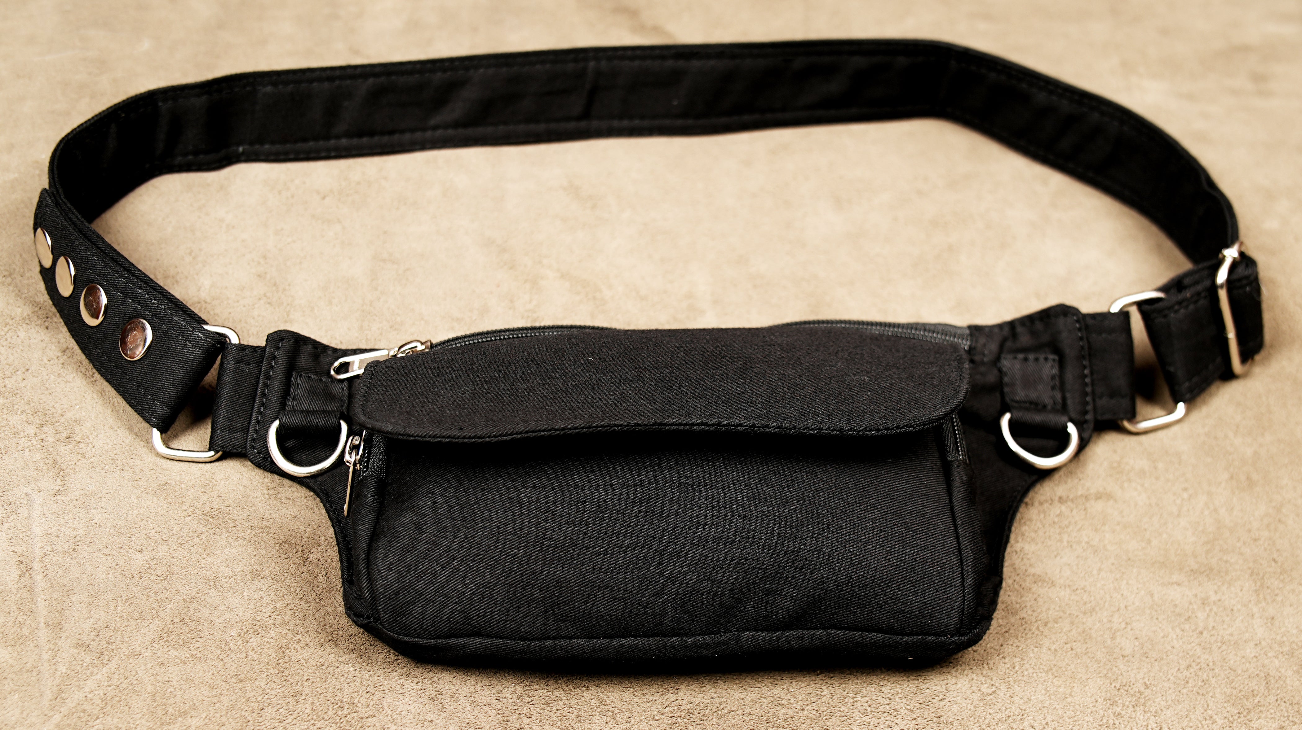 Stylish black waist belt pack suitable for casual wear, concerts, and outdoor trips.
