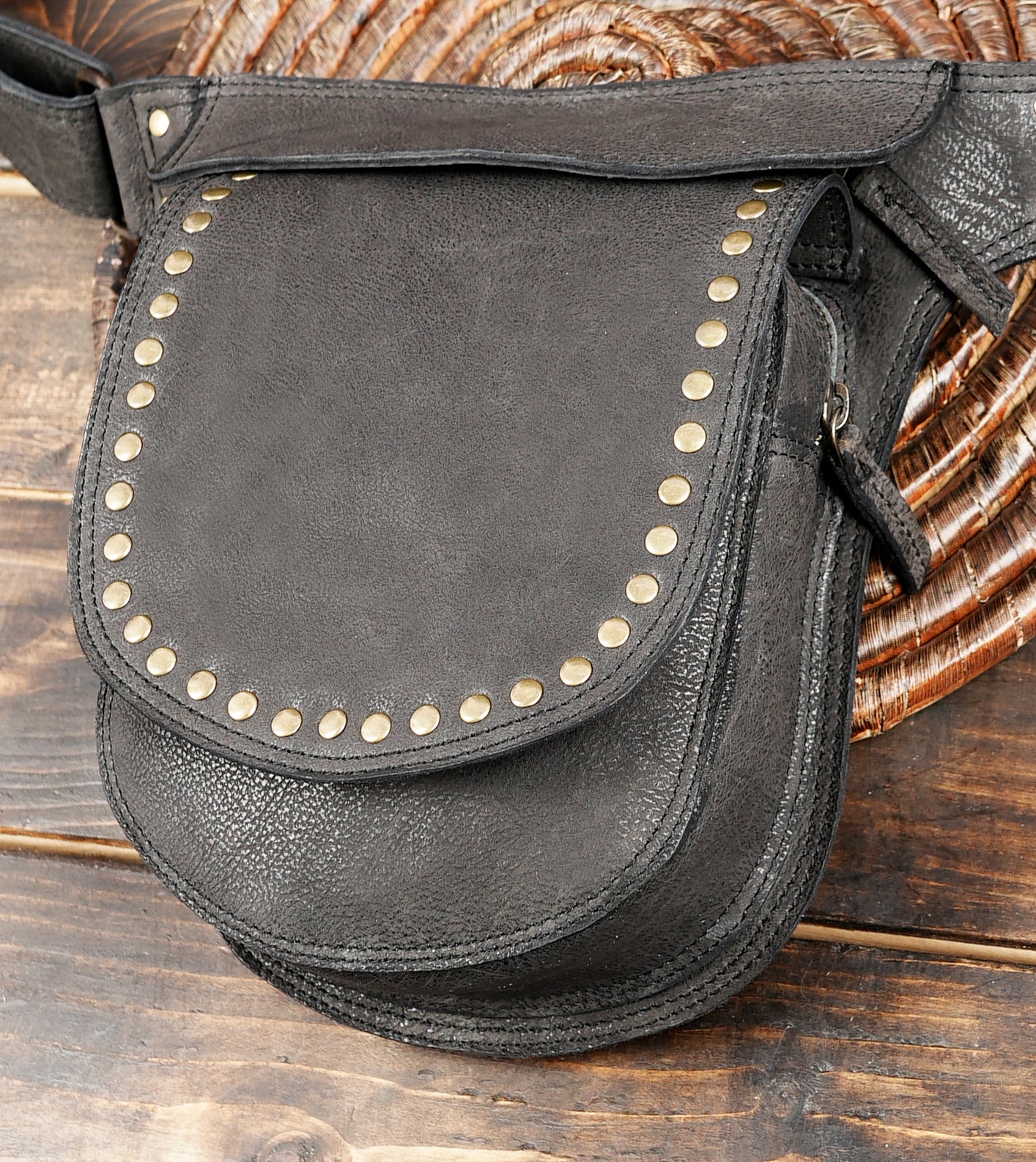 Utility leather waist belt with adjustable strap and front pocket