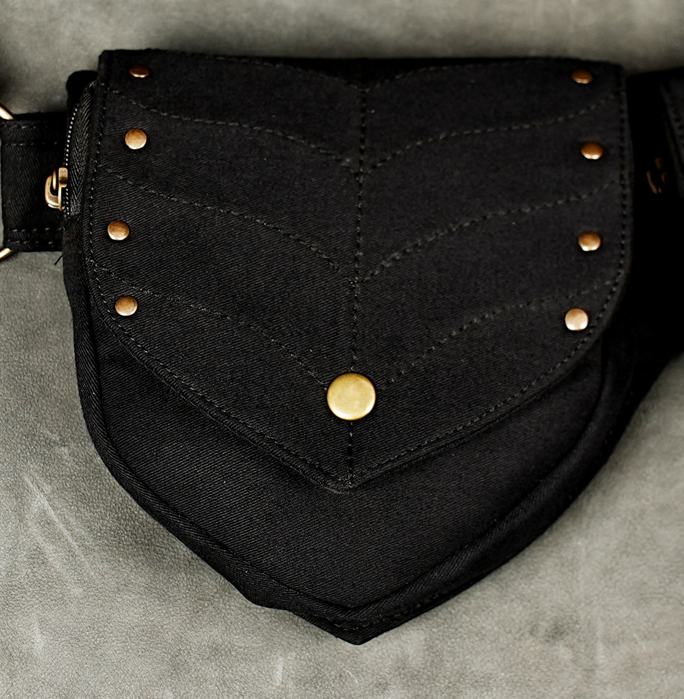 Black cotton fanny pack belt with brass O-rings and adjustable strap