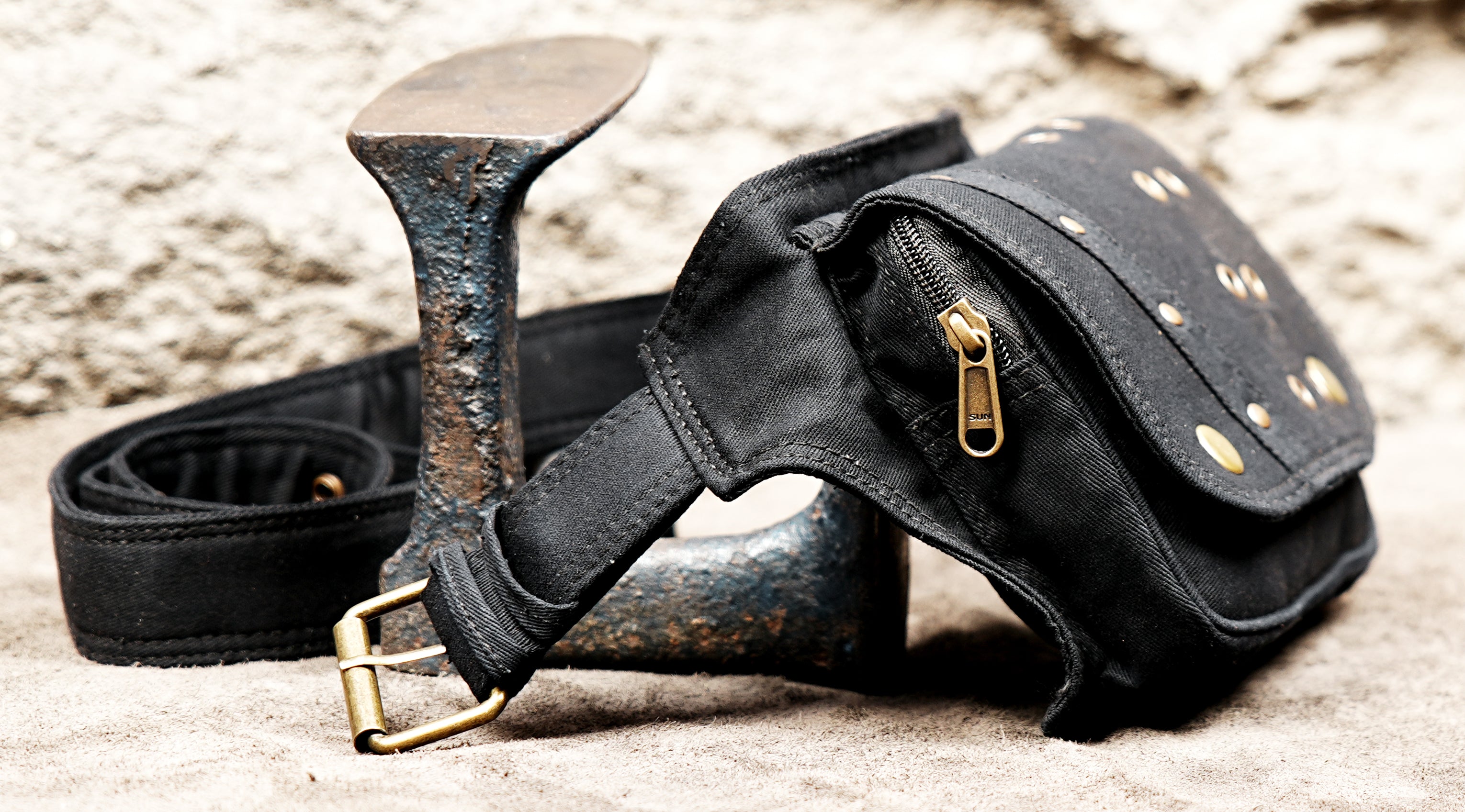 Black cotton festival belt bag with metal eyelets and stud details