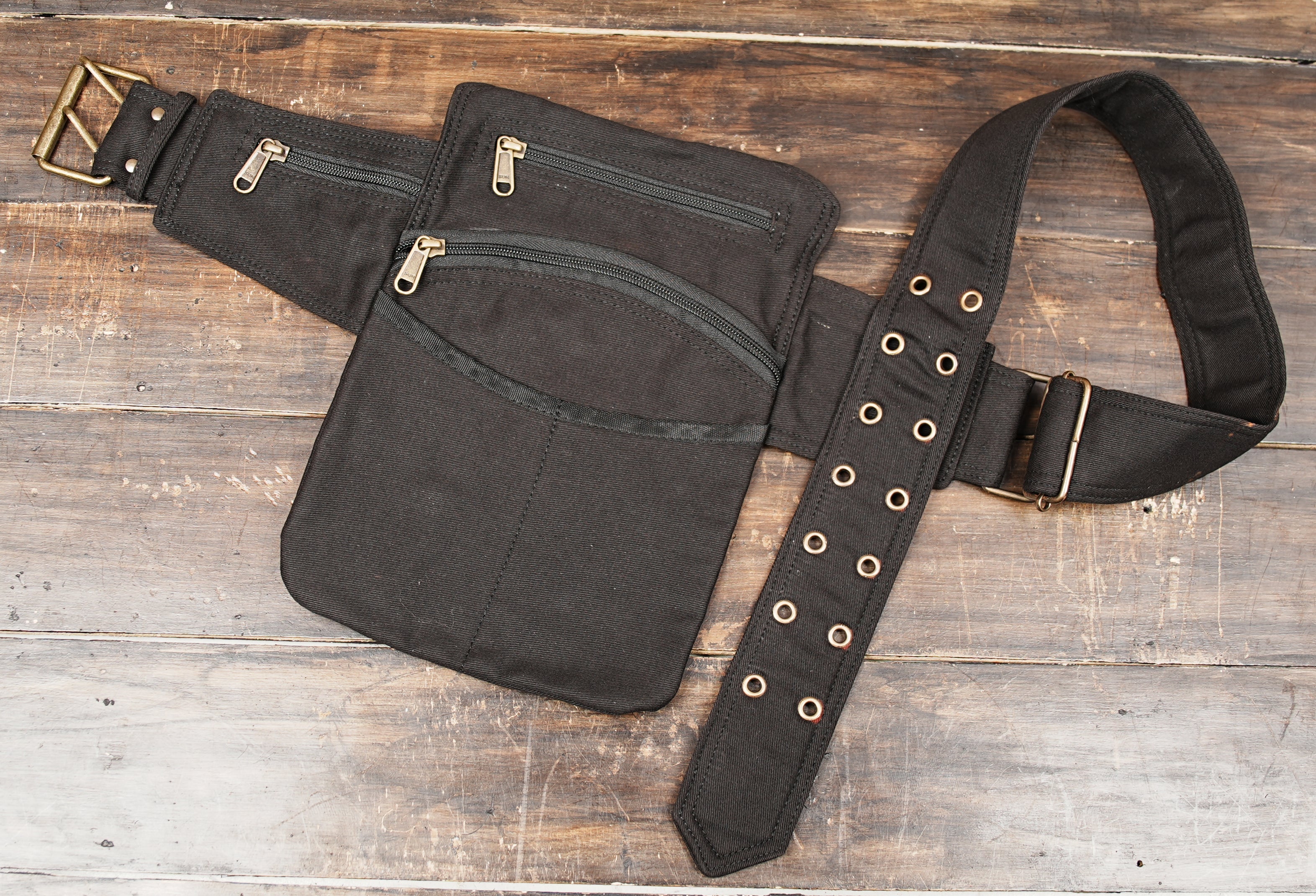 Black utility fanny pack with adjustable waist strap and zipper compartments