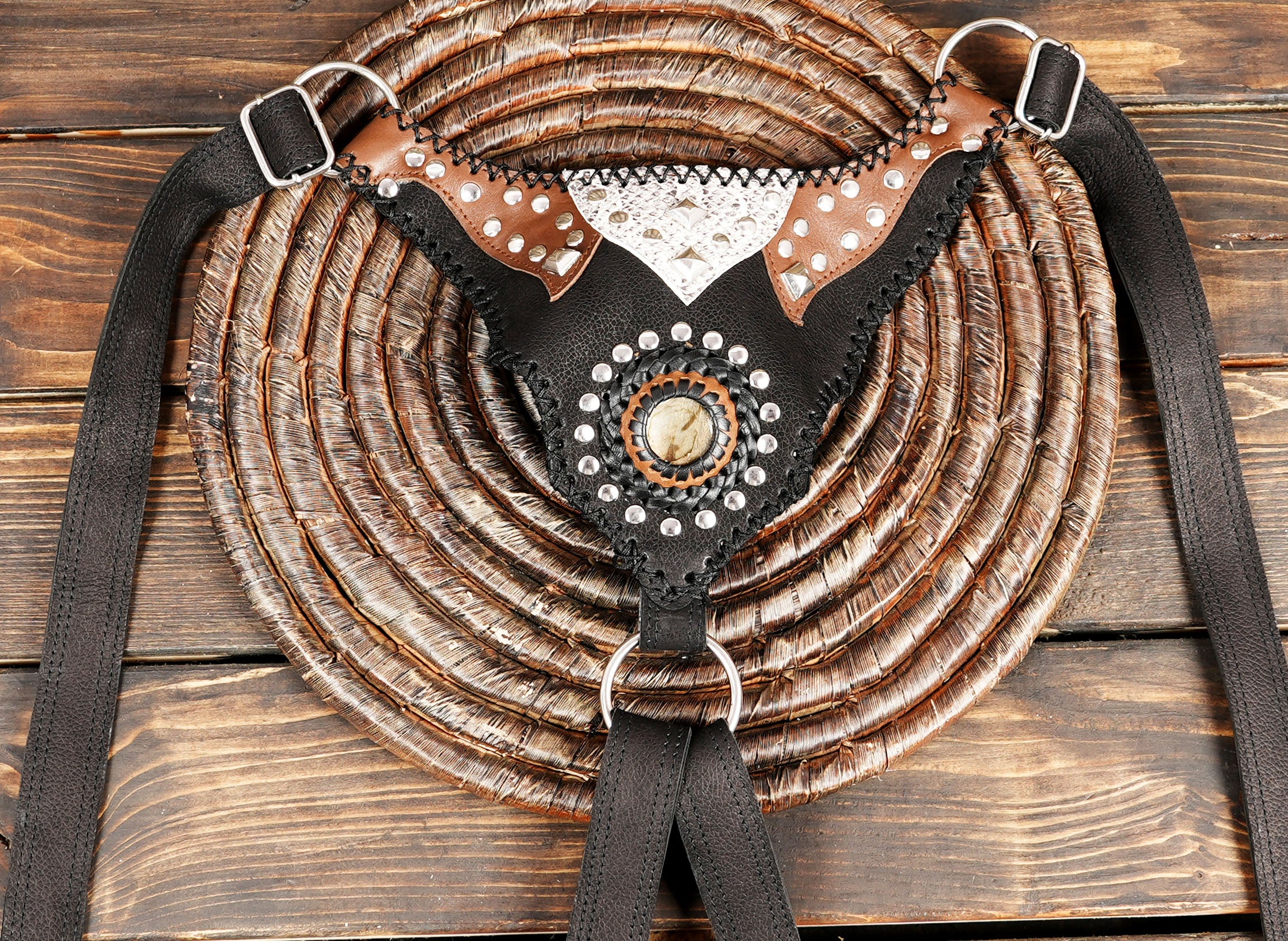 Rustic black and brown leather festival bag with decorative rivets