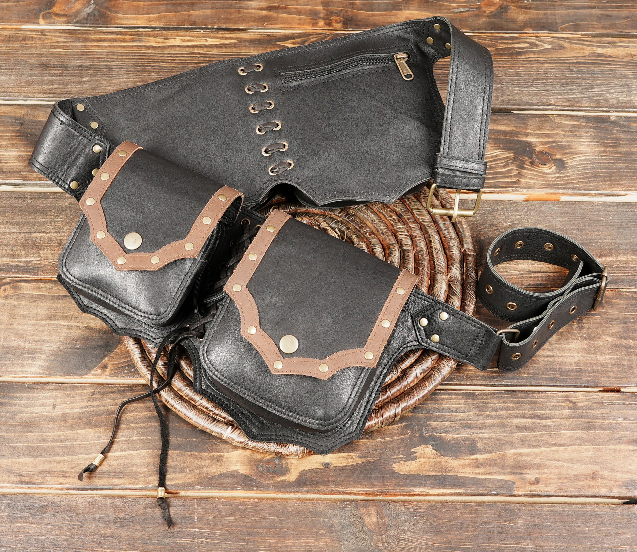 The black leather base combined with brown trim and rivet detailing gives this belt a bold