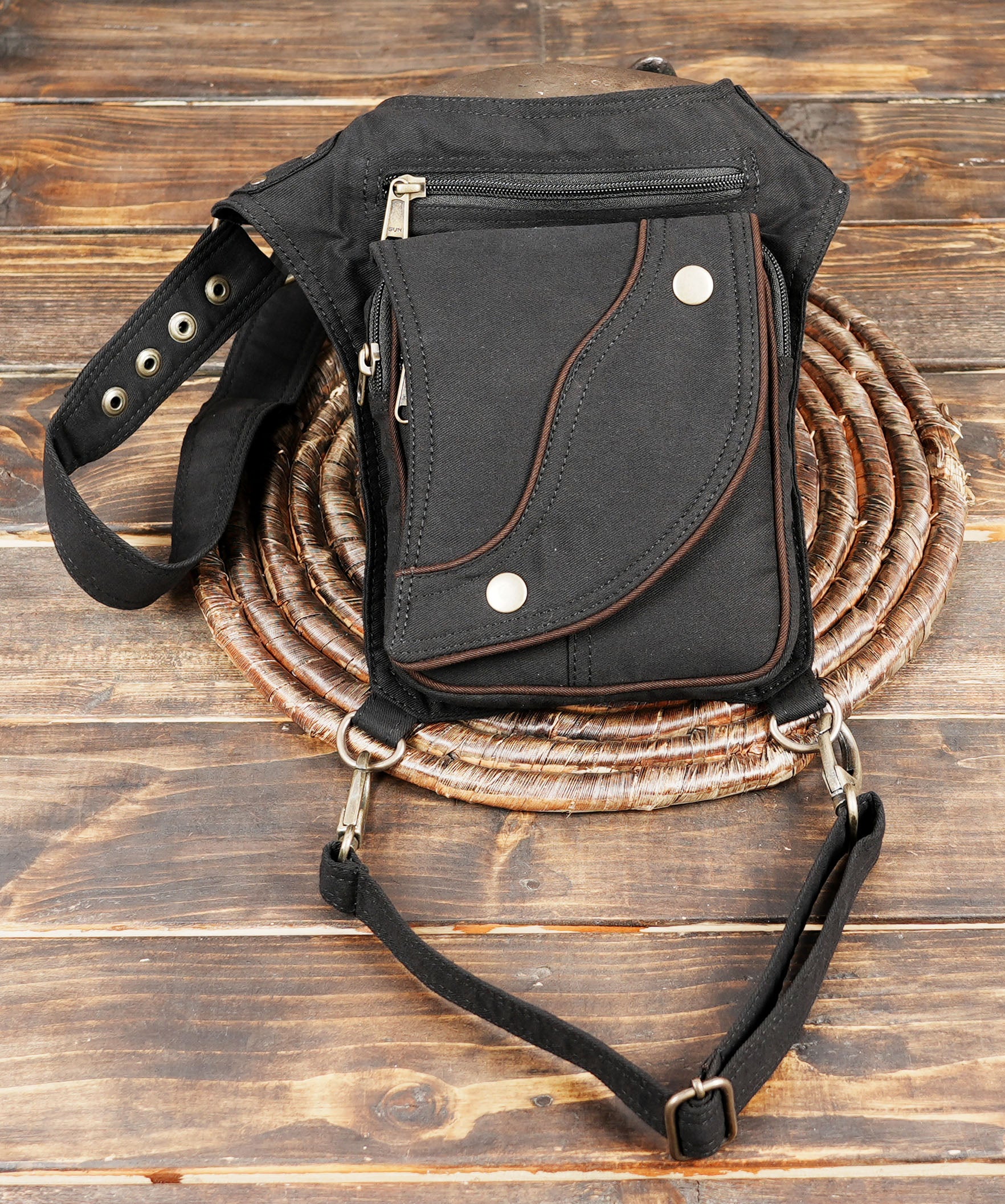 Unisex cotton canvas hip and thigh bag with multi-pocket zippered storage for travel and festivals.