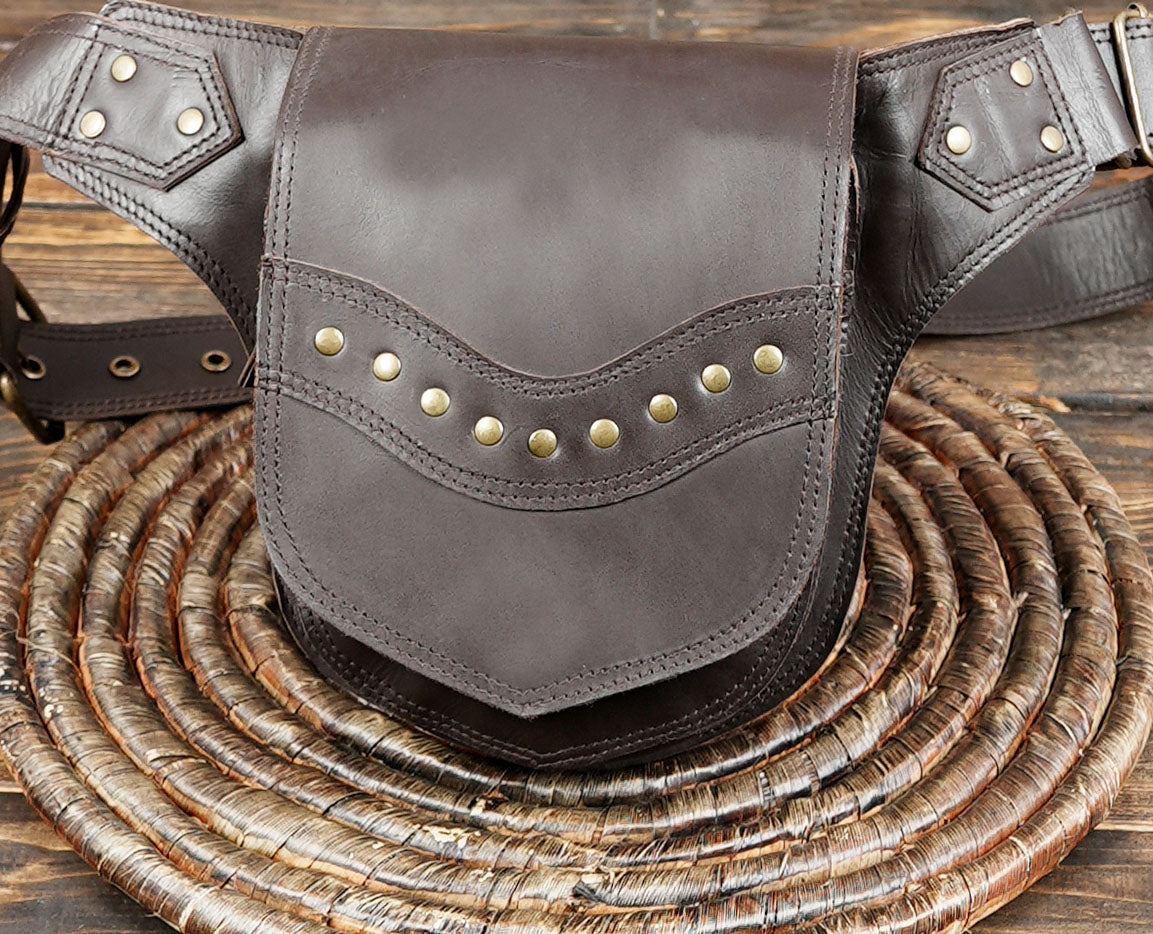 Artisan leather waist pack with brass rivet accents