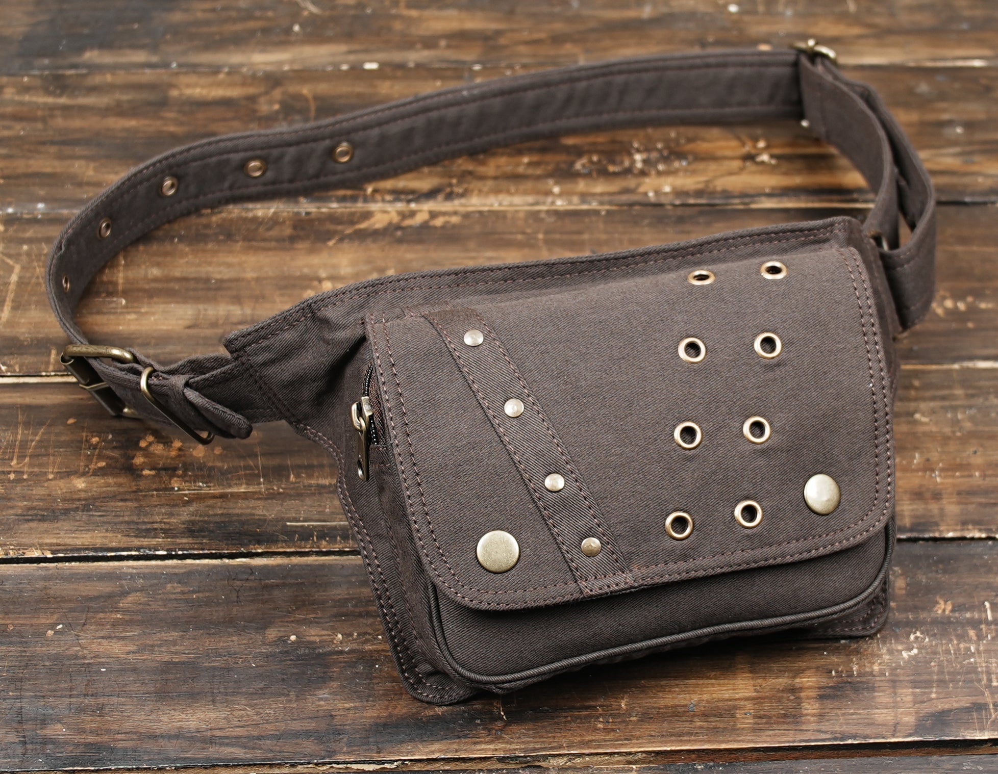 Brown crossbody fanny pack with front flap and snap closure