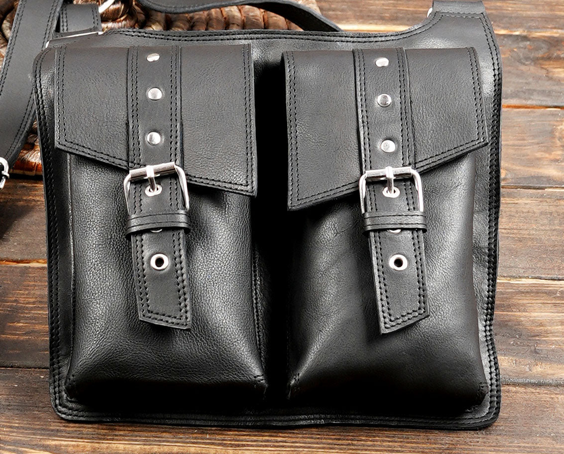 Utility leather shoulder holster featuring four spacious pockets