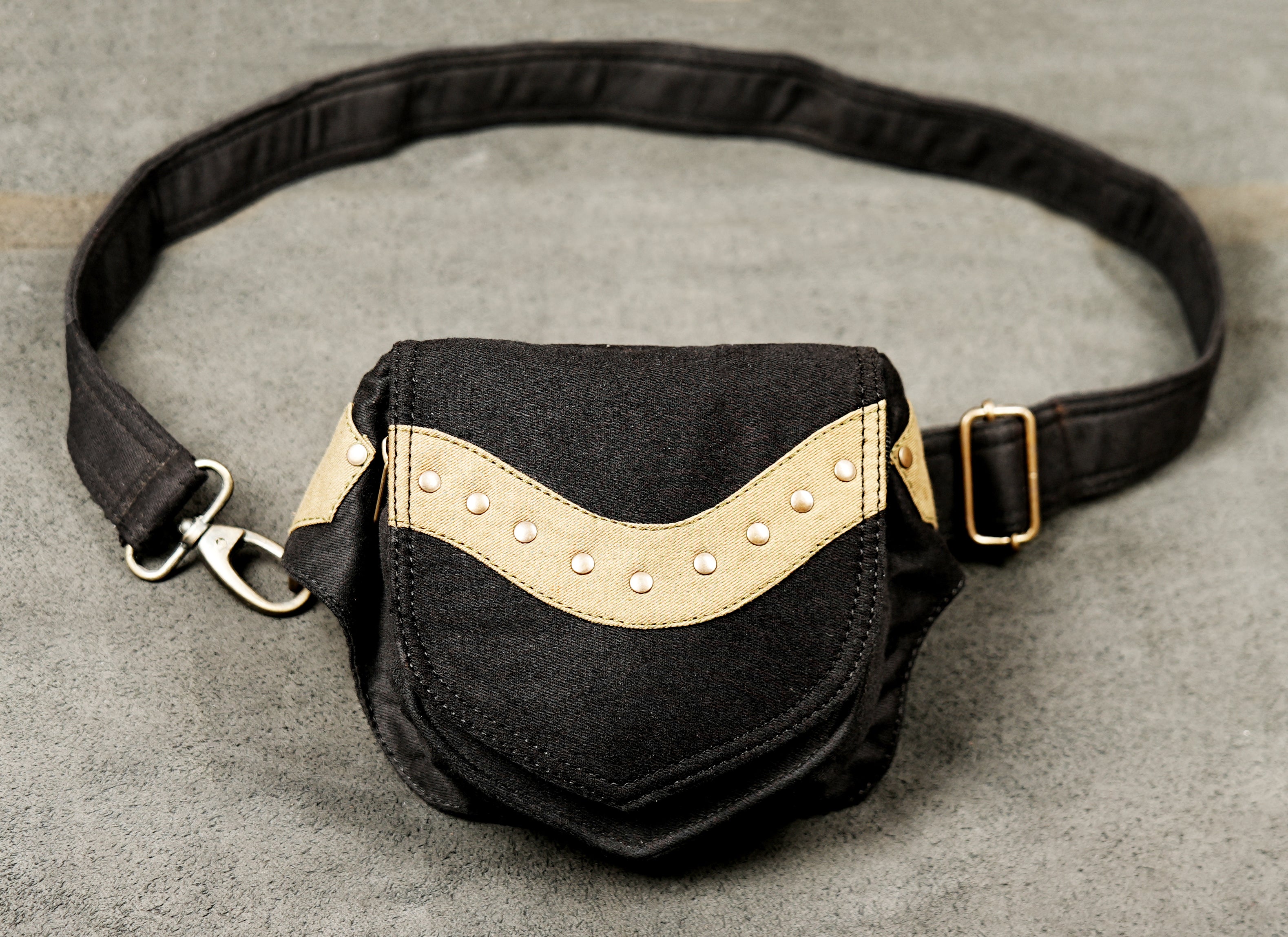 A stylish fanny pack (USA) / bumbag (Europe/Australia) with an adjustable strap and gold-tone metal buckle.