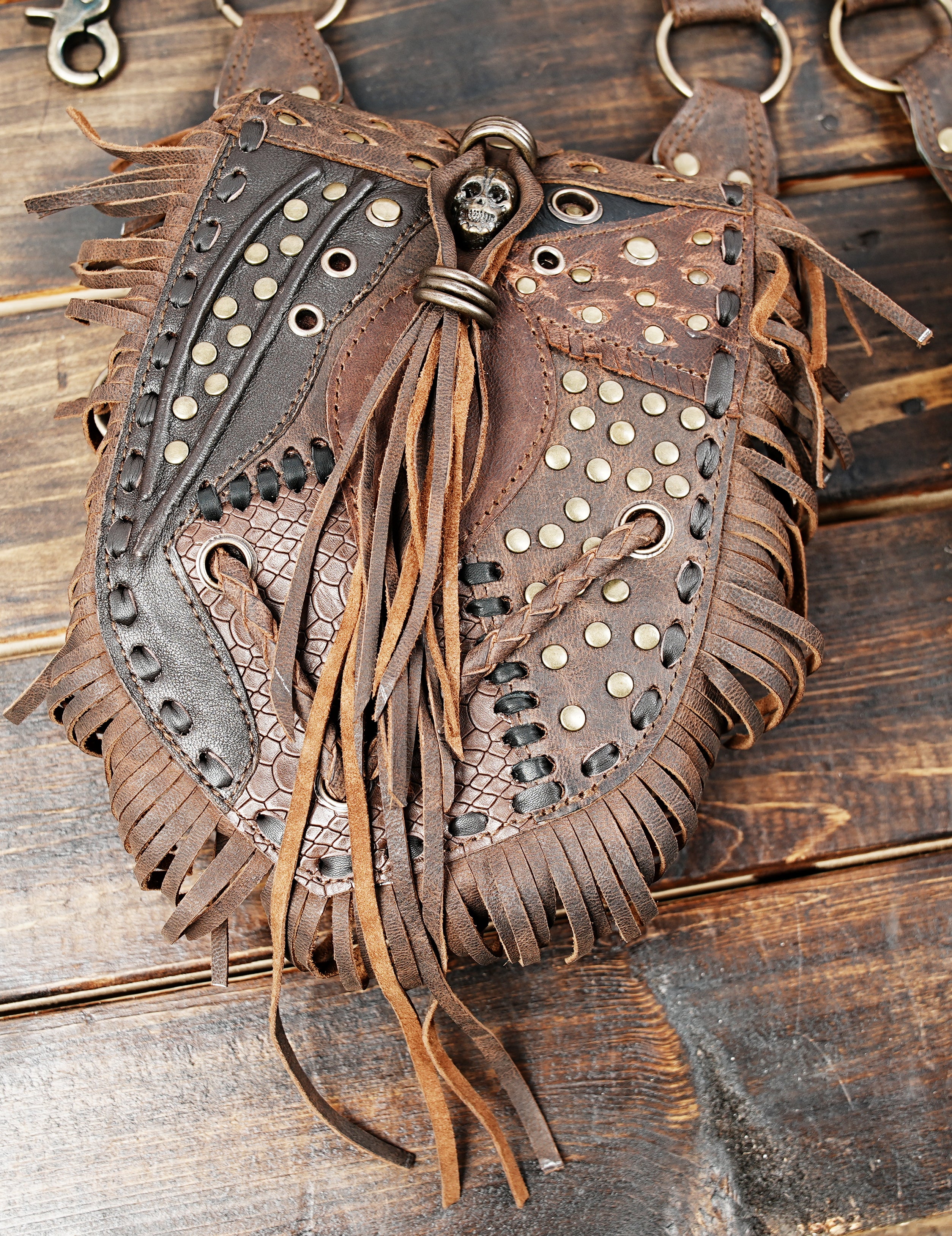 Festival-ready leather holster bag with adjustable straps and rustic charm.