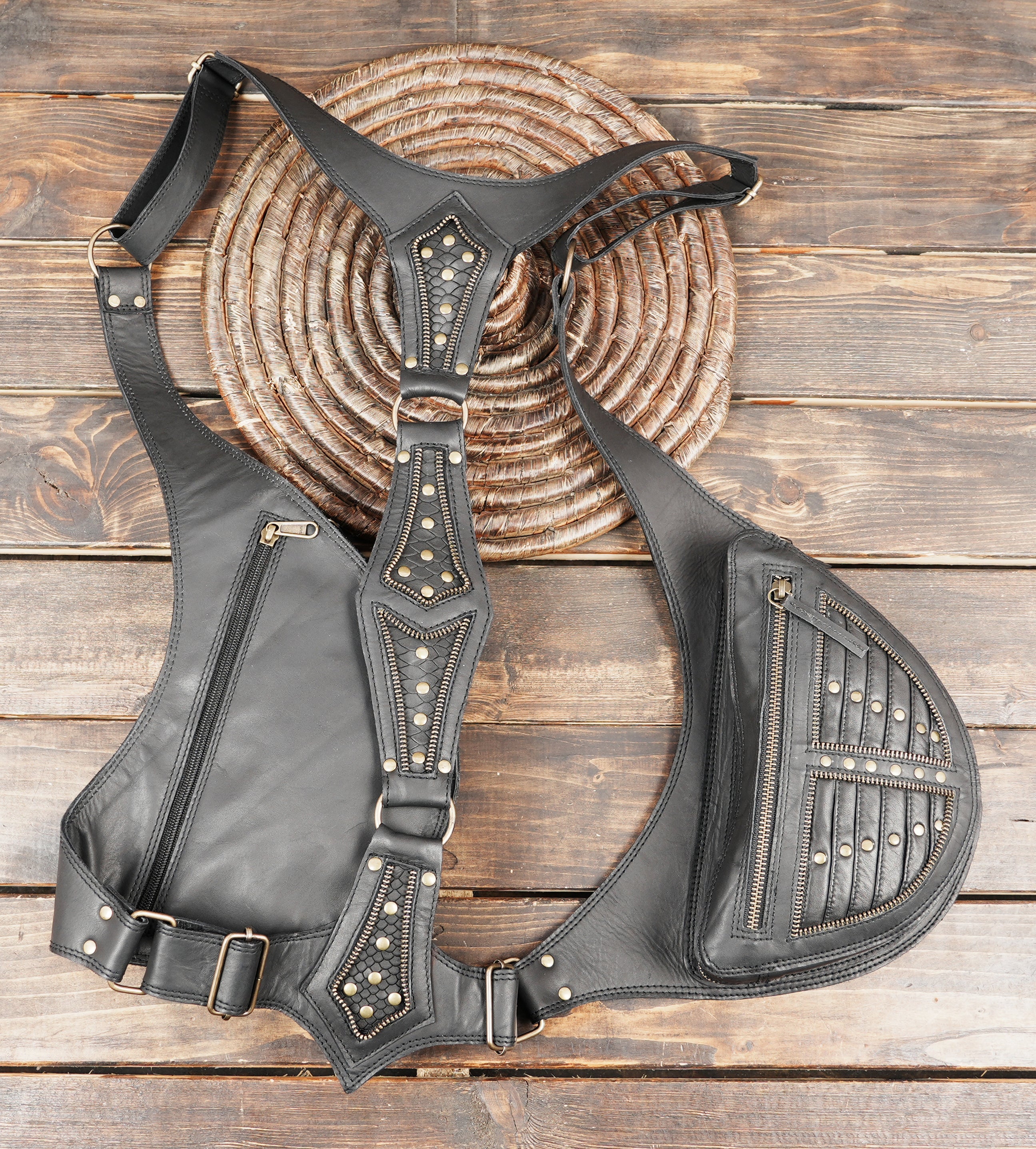 Steampunk inspired leather holster with metal hardware and zip compartments