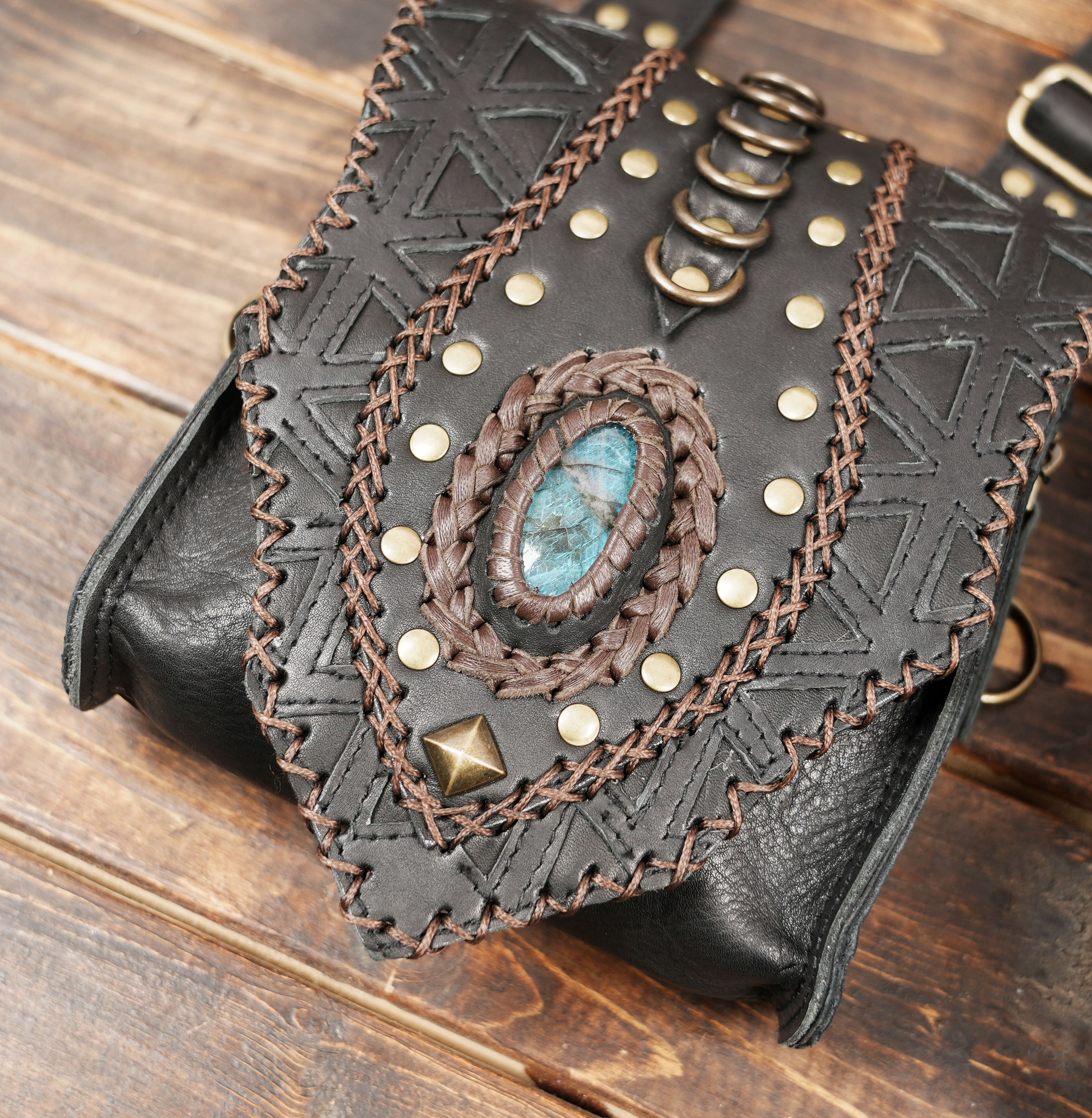 “Handcrafted leather chest holster with two pouches and detailed stitching”