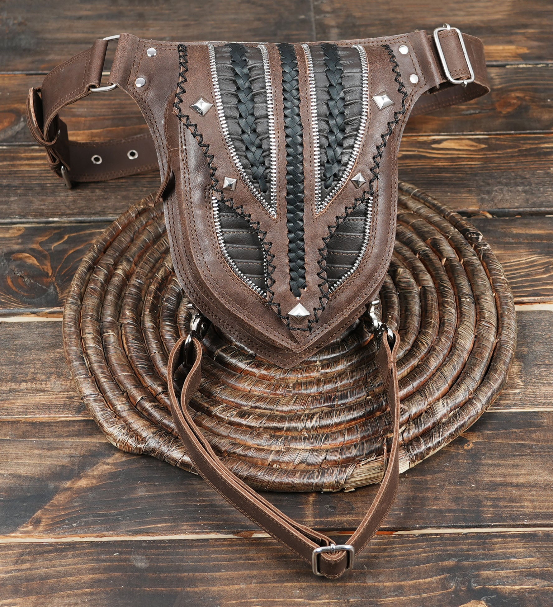 Steampunk thigh holster belt with adjustable straps and rivets.