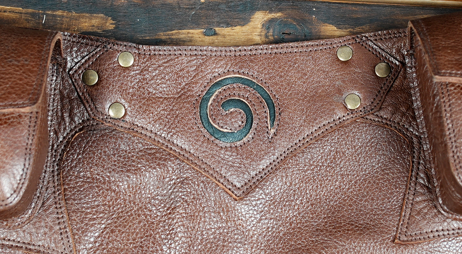 Genuine leather skirt in vintage brown with belt pouches, designed for Burning Man fashion.