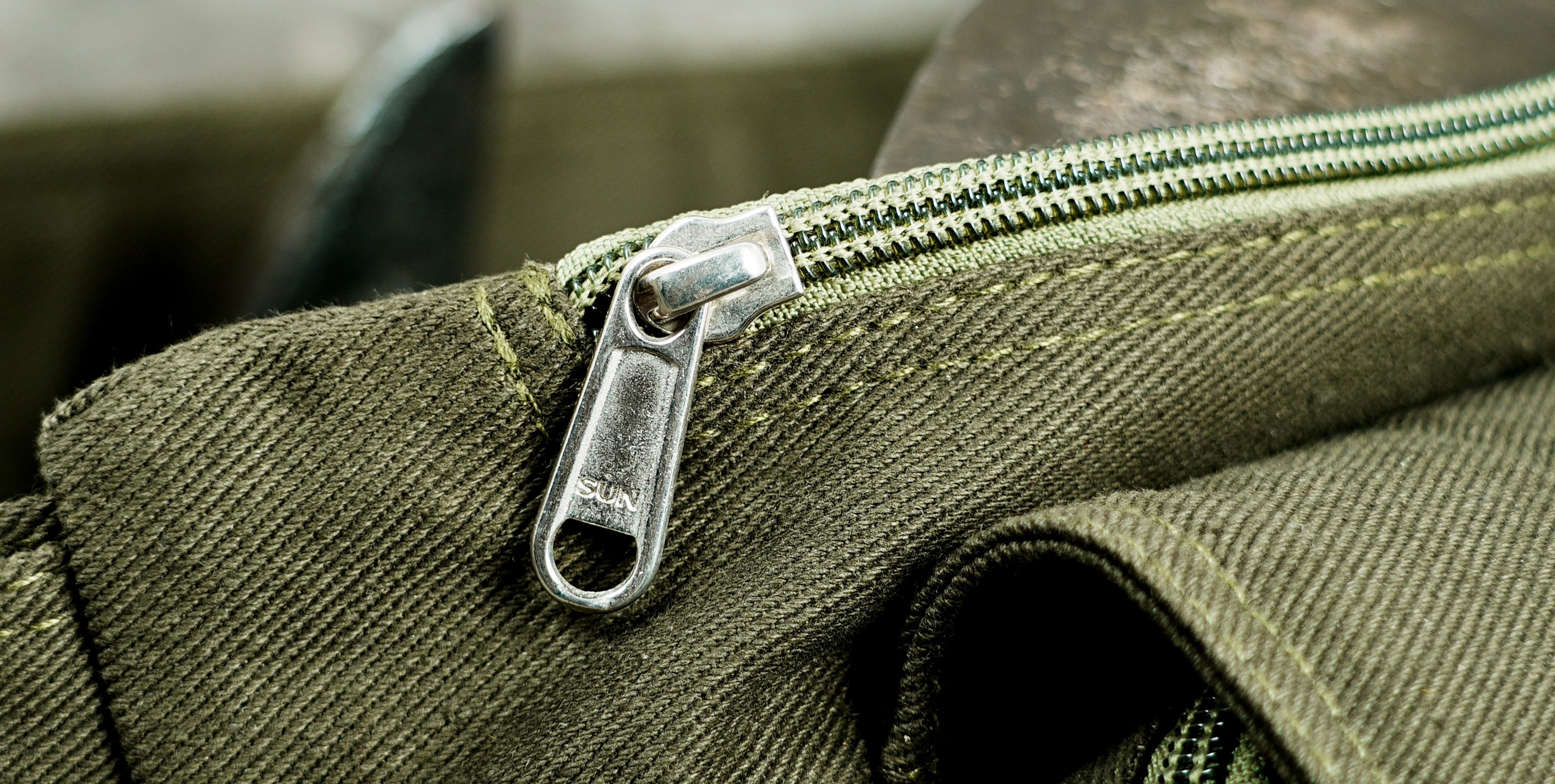 Olive green festival hip bag with silver snap buttons on the belt
