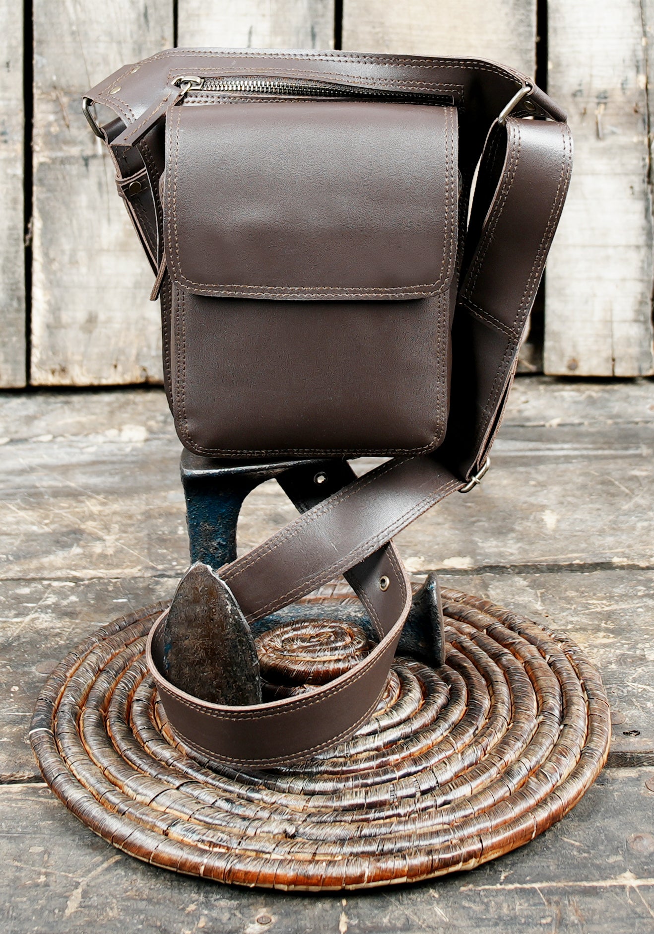 Rustic brown leather utility belt with front storage pouch