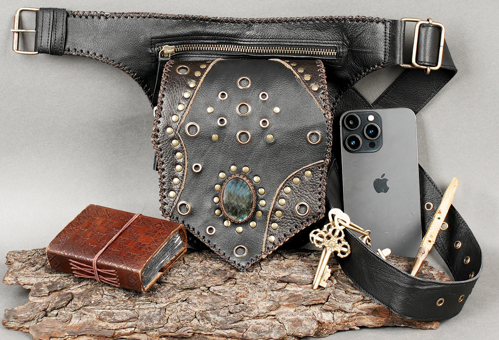 Adjustable leather waist belt with studded pouch and gemstone